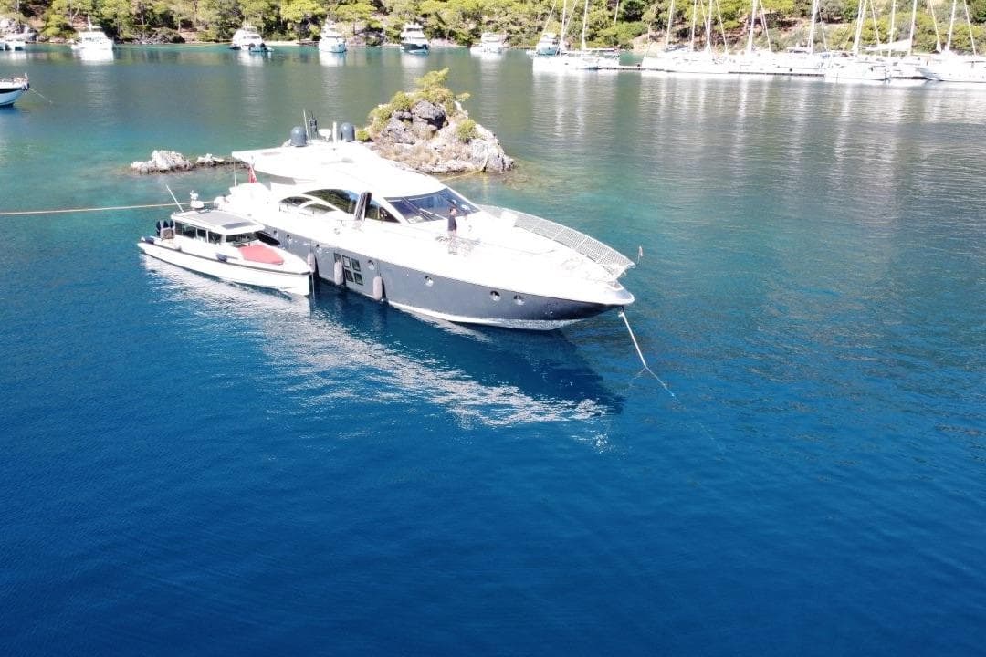 Luxury Azimut 86S yacht anchored in serene blue waters, 2007 model.