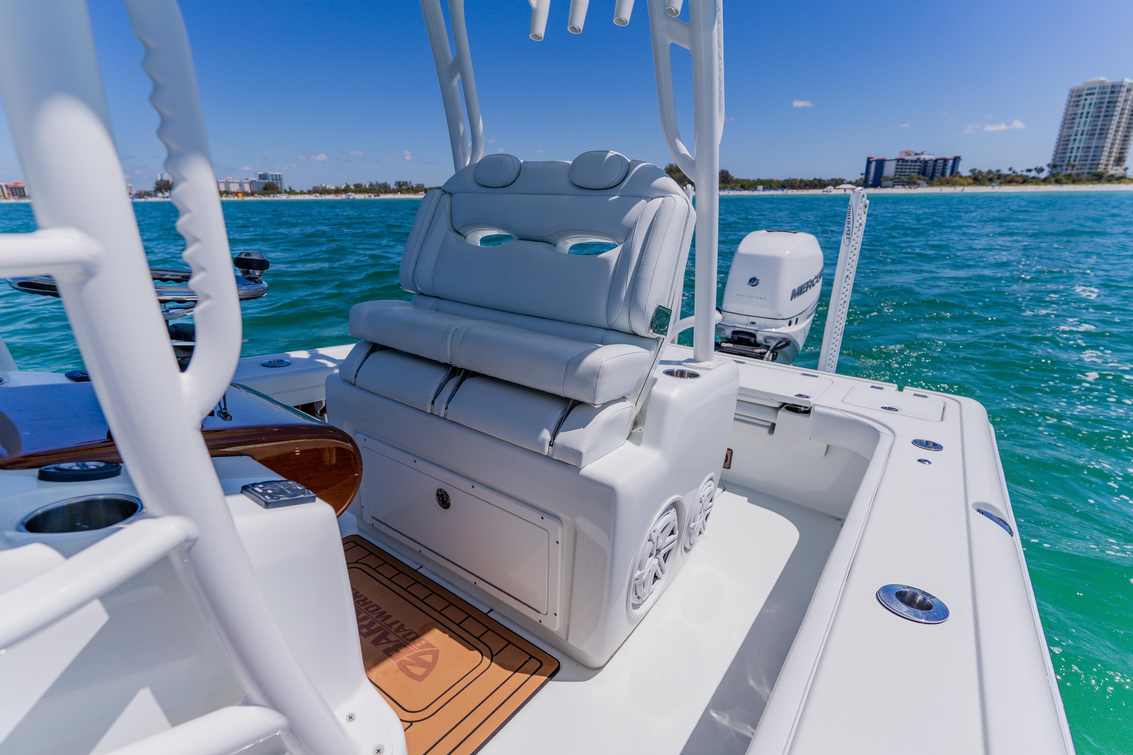 2017 Barker Boatworks 26 on turquoise water, featuring sleek seating and modern design.
