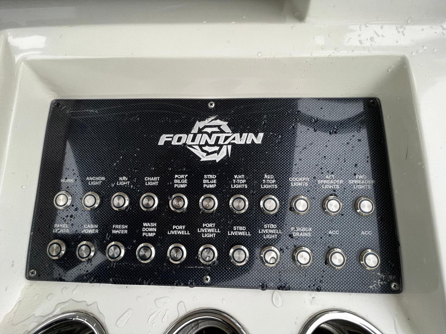 Control panel of a 2011 Fountain 38 CC Tournament Edition boat with labeled switches.