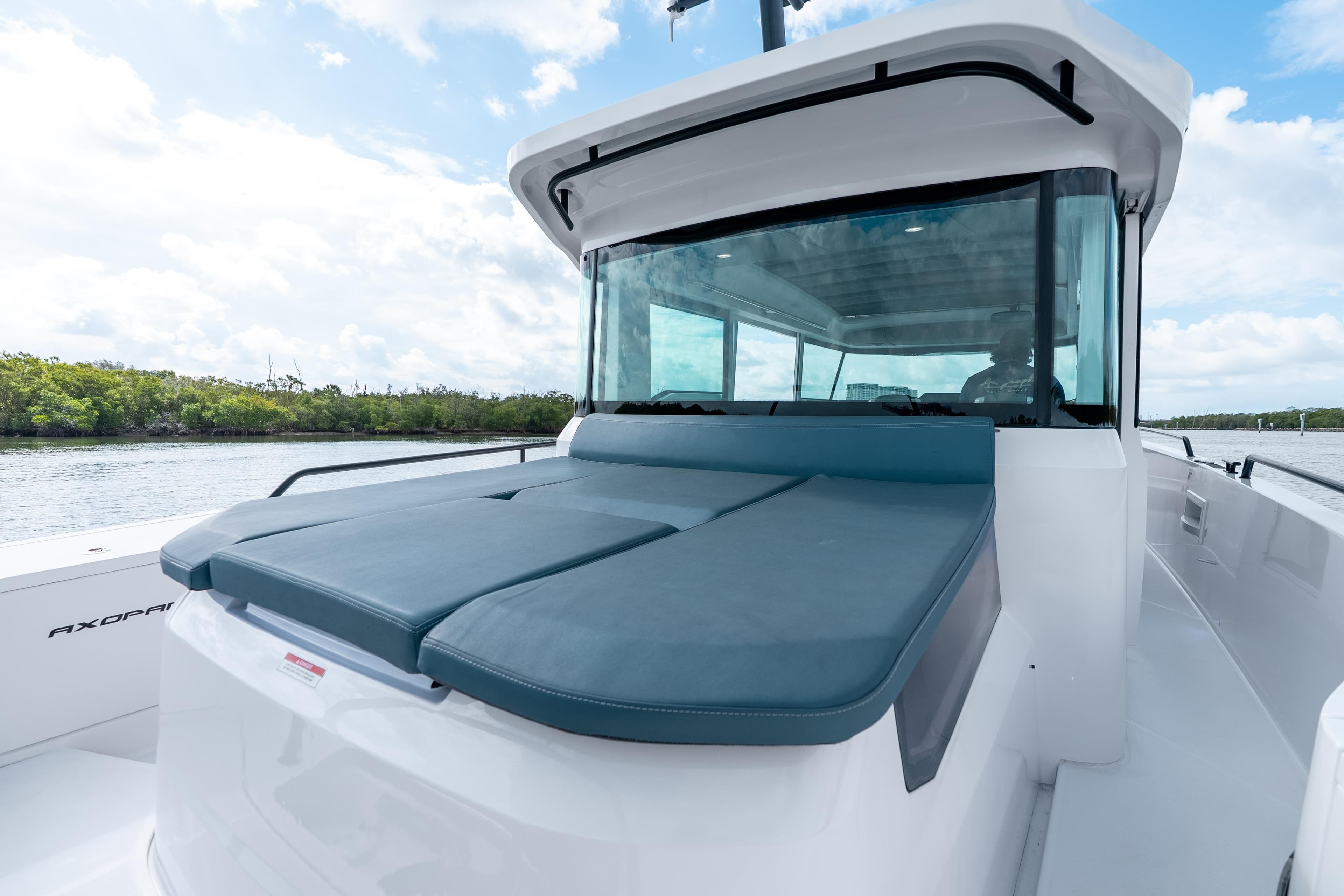 2022 Axopar 37 XC Cross Cabin boat with sleek design on calm water.