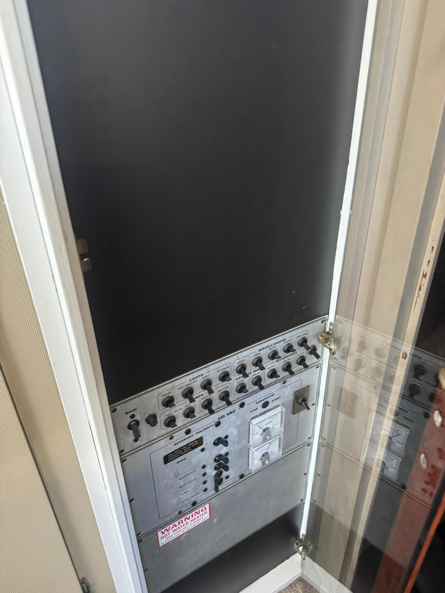 Electrical control panel inside a 1986 Carver Mariner 28 boat.