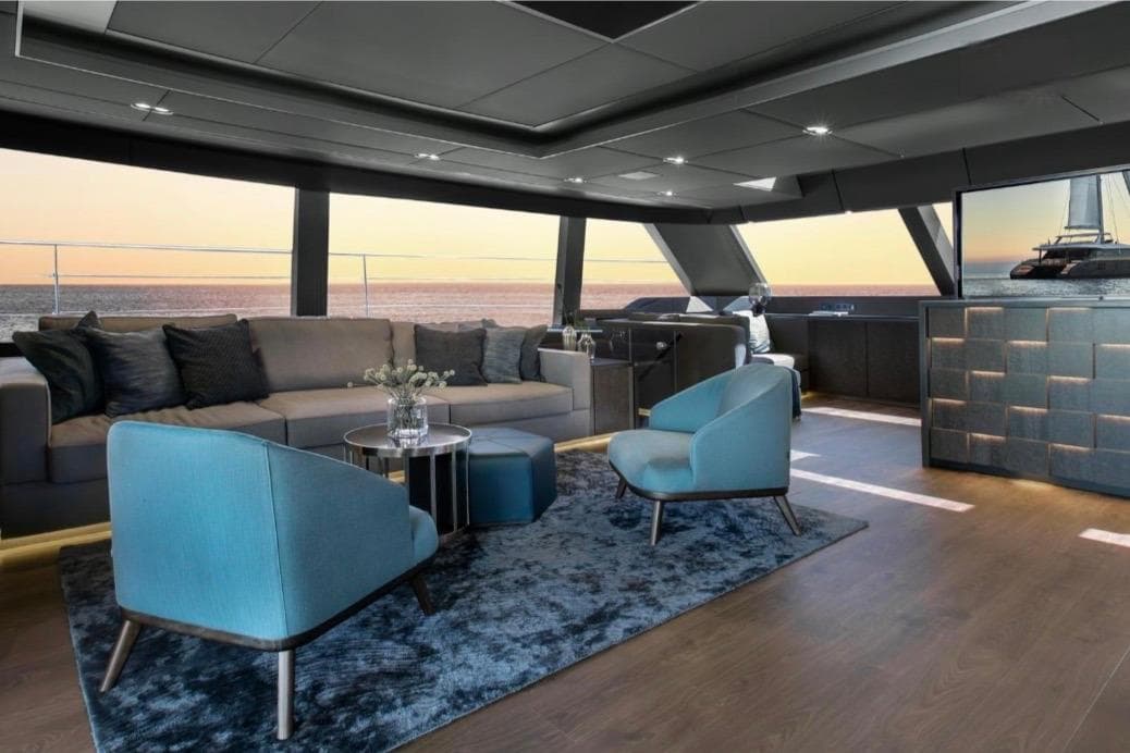 Luxurious Sunreef Power 80 yacht interior, featuring elegant seating and panoramic ocean views.