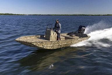 Manufacturer Provided Image: 2026 Crestliner 1870 Retriever FCC boat speeding on open water, with driver standing.