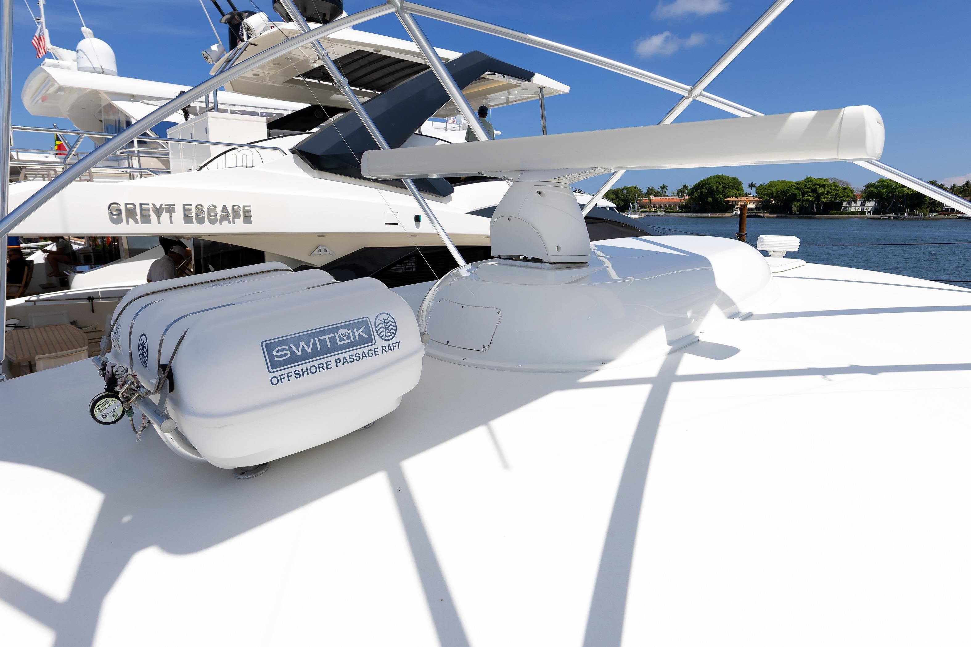 2017 Viking 52 Sport Tower yacht with Switlik offshore passage raft on deck.