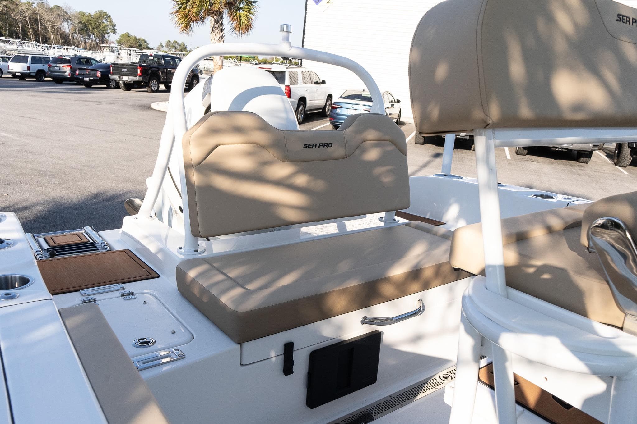 2026 Sea Pro 225FLXR Sandbar boat interior with tan seating and white accents.