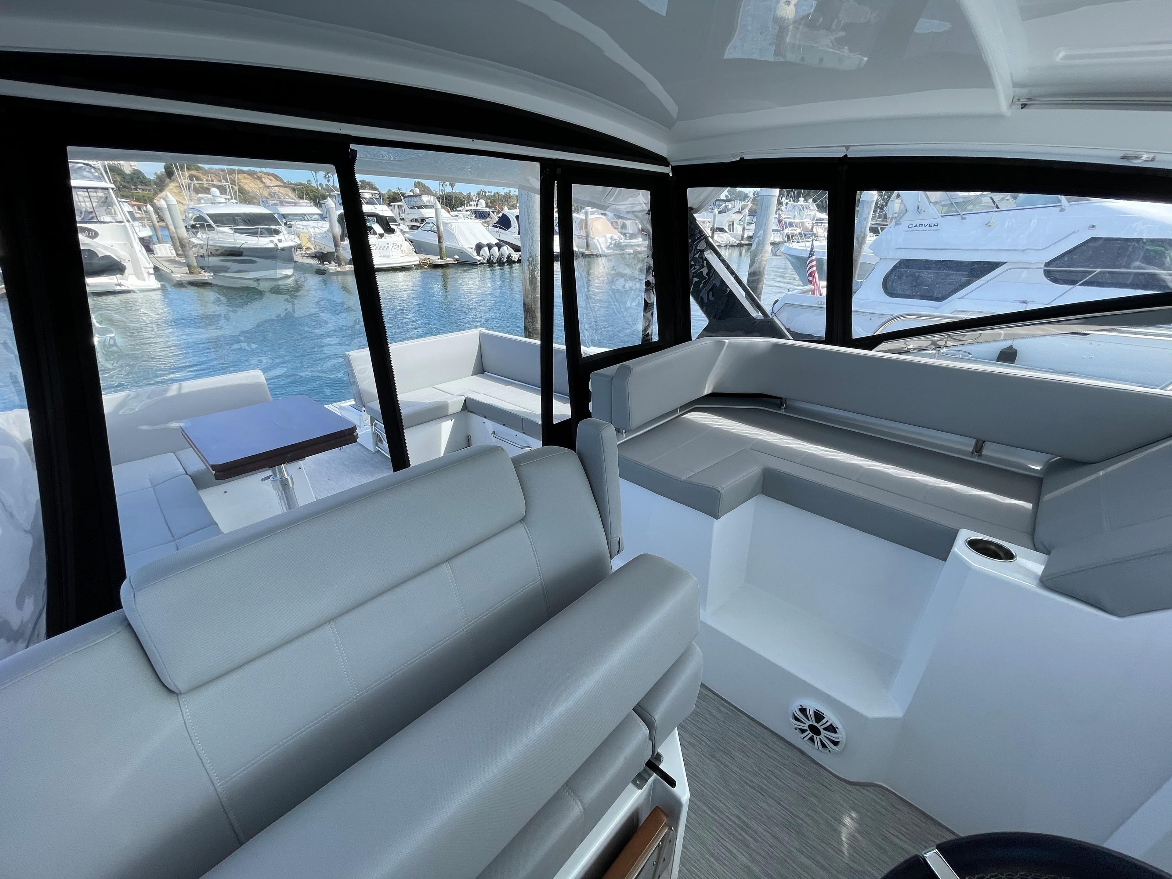 Interior of 2020 Cruisers Yachts 390 Express Coupe with marina view.