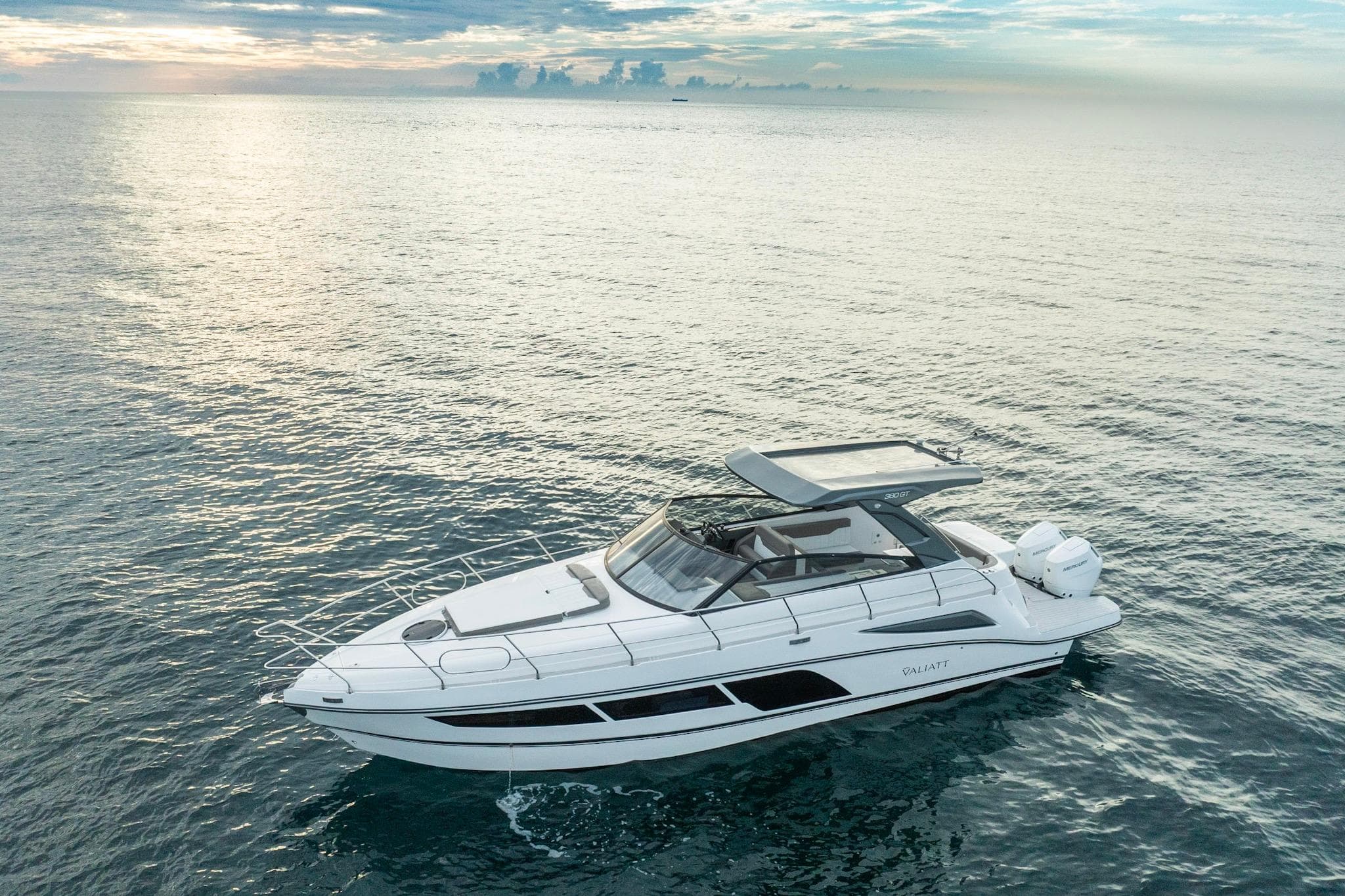 Valiatt 380GT 2025 luxury yacht cruising on serene ocean waters at sunset.