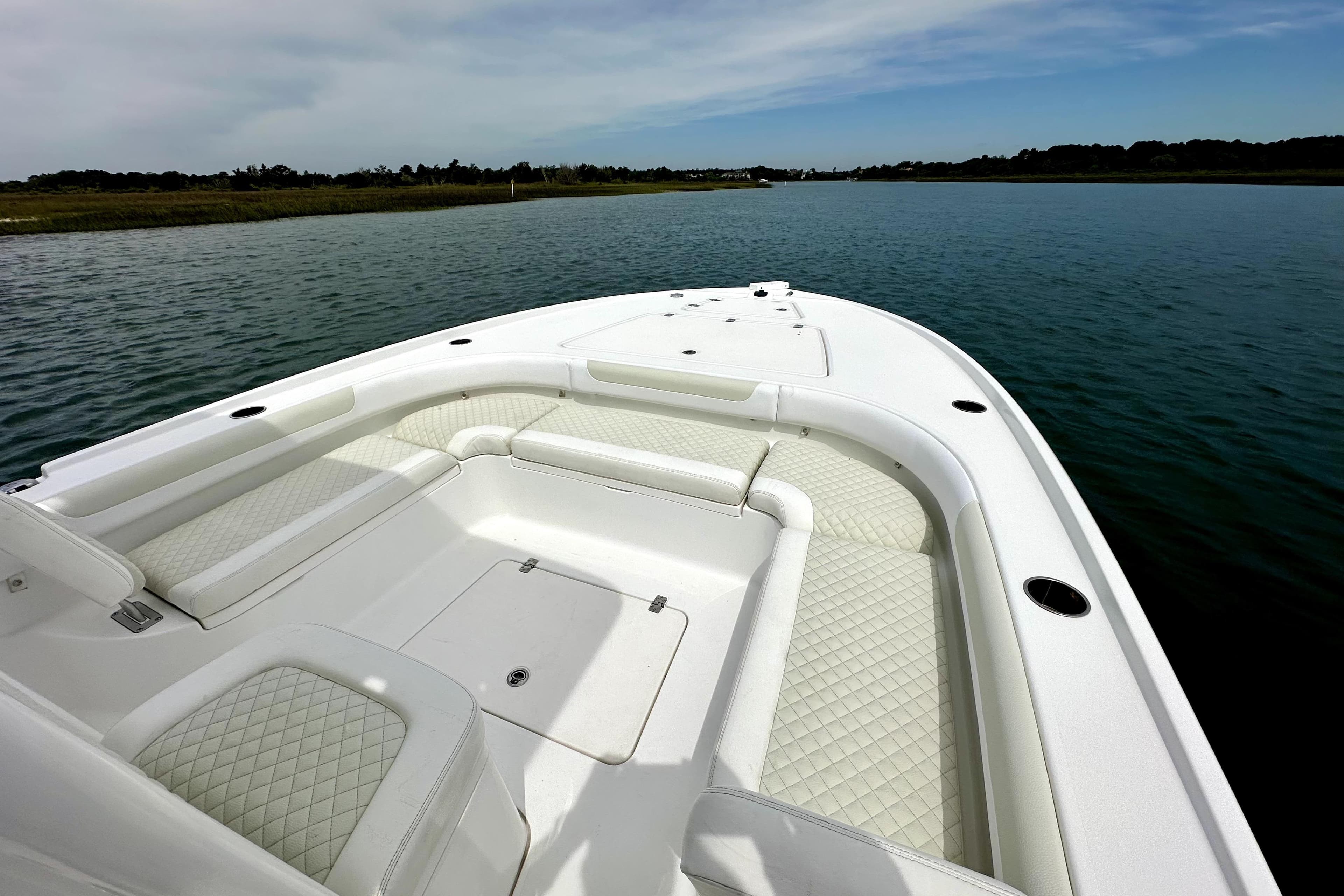 2020 Caymas 26 HB boat with spacious seating on calm water.