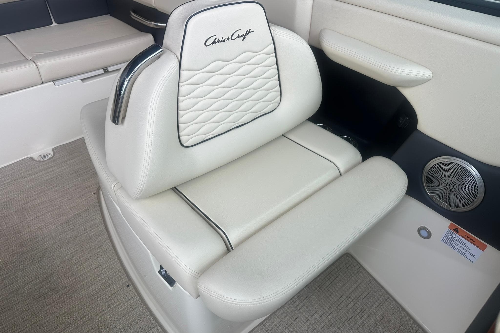 2026 Chris-Craft Sportster 25 interior with luxurious white leather seating and elegant design.