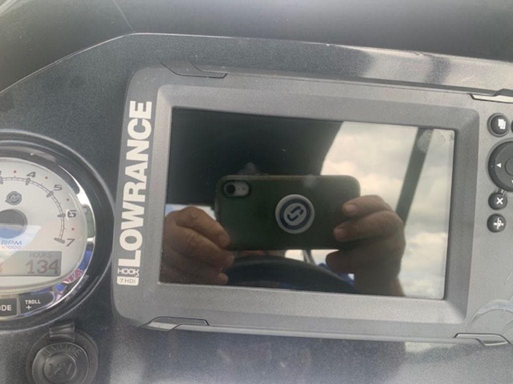 Lowrance HDS-7 display on 2020 Regency 230 DL3 boat dashboard.