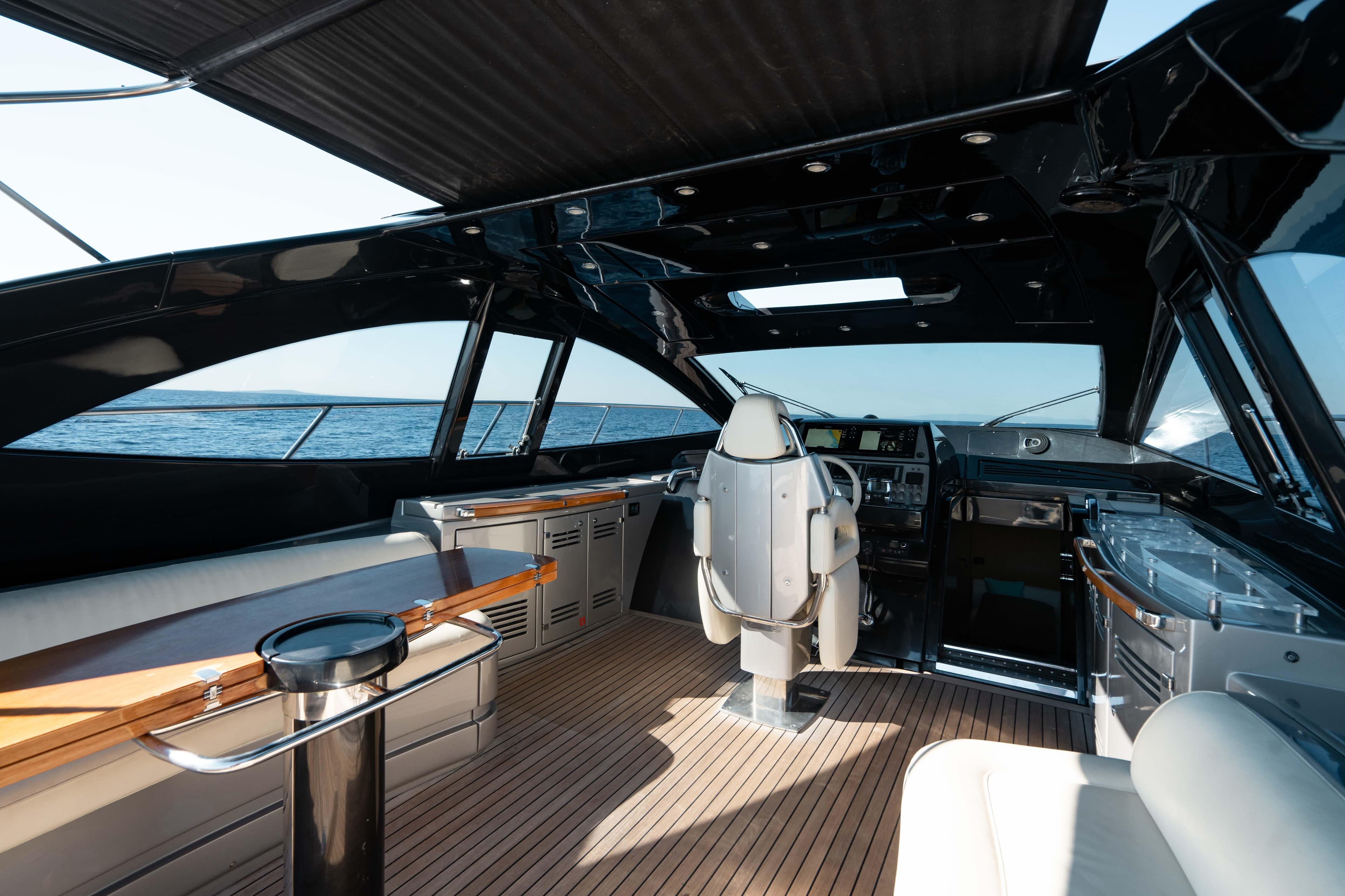 Luxurious interior of a 2009 Riva 63 Vertigo yacht with sleek design and ocean view.