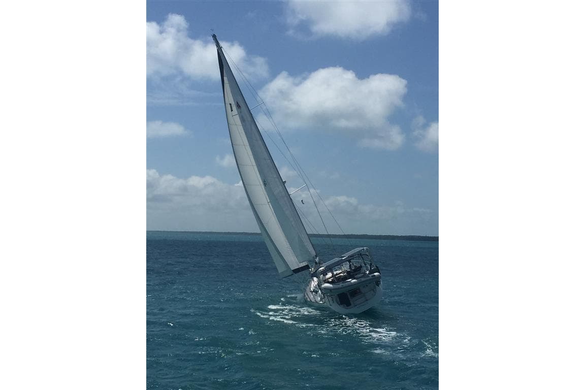 Sailing yacht Catalina 470 (2000) navigating on open sea under clear skies.