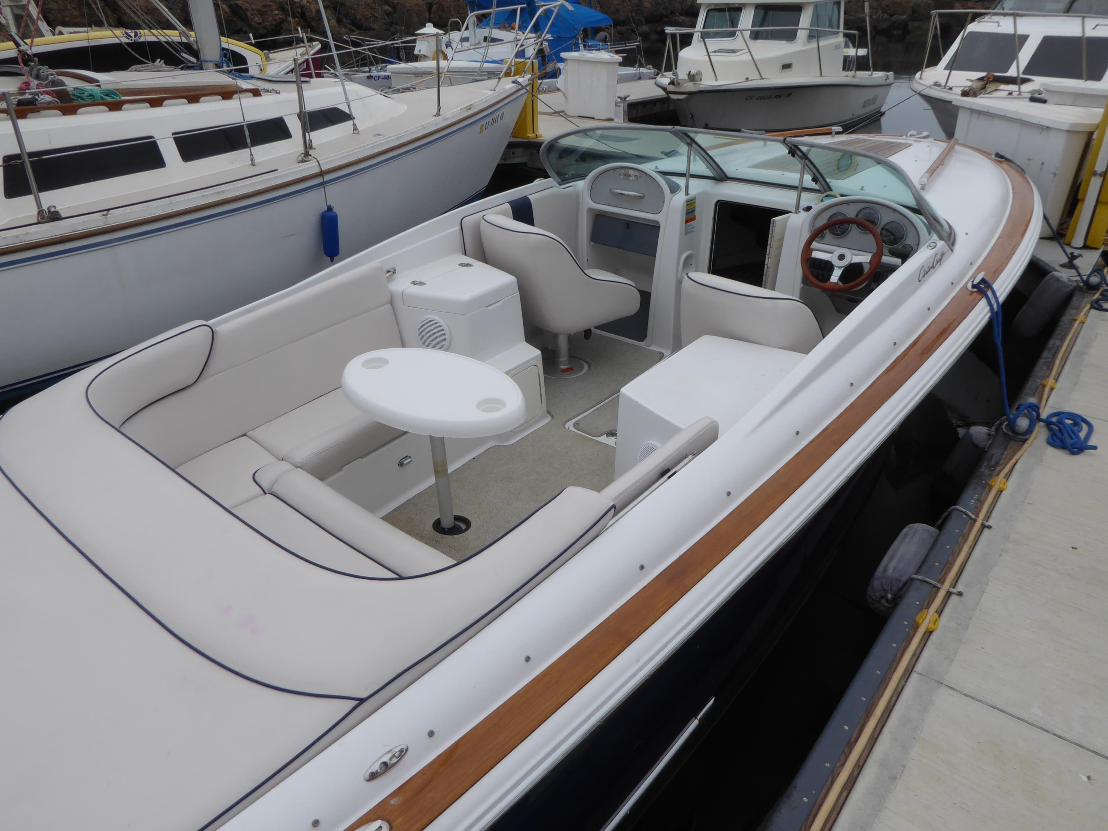 2004 Chris-Craft Corsair 25 boat docked, featuring sleek design.
