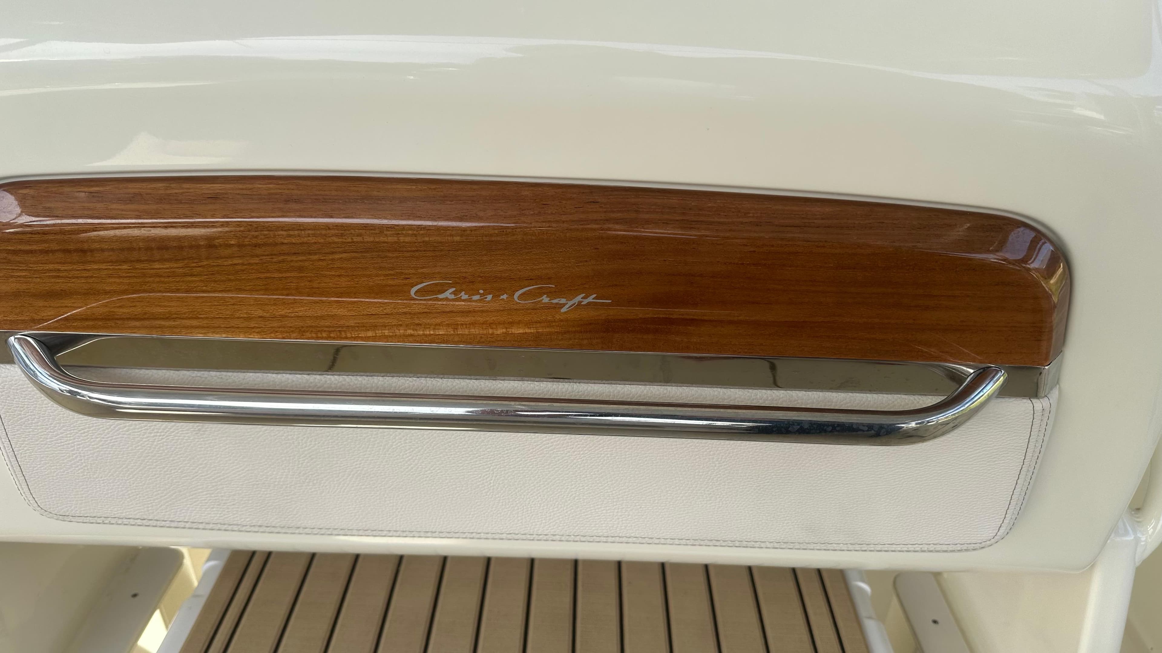 2023 Chris-Craft Catalina 24 interior detail with wood and chrome accents.