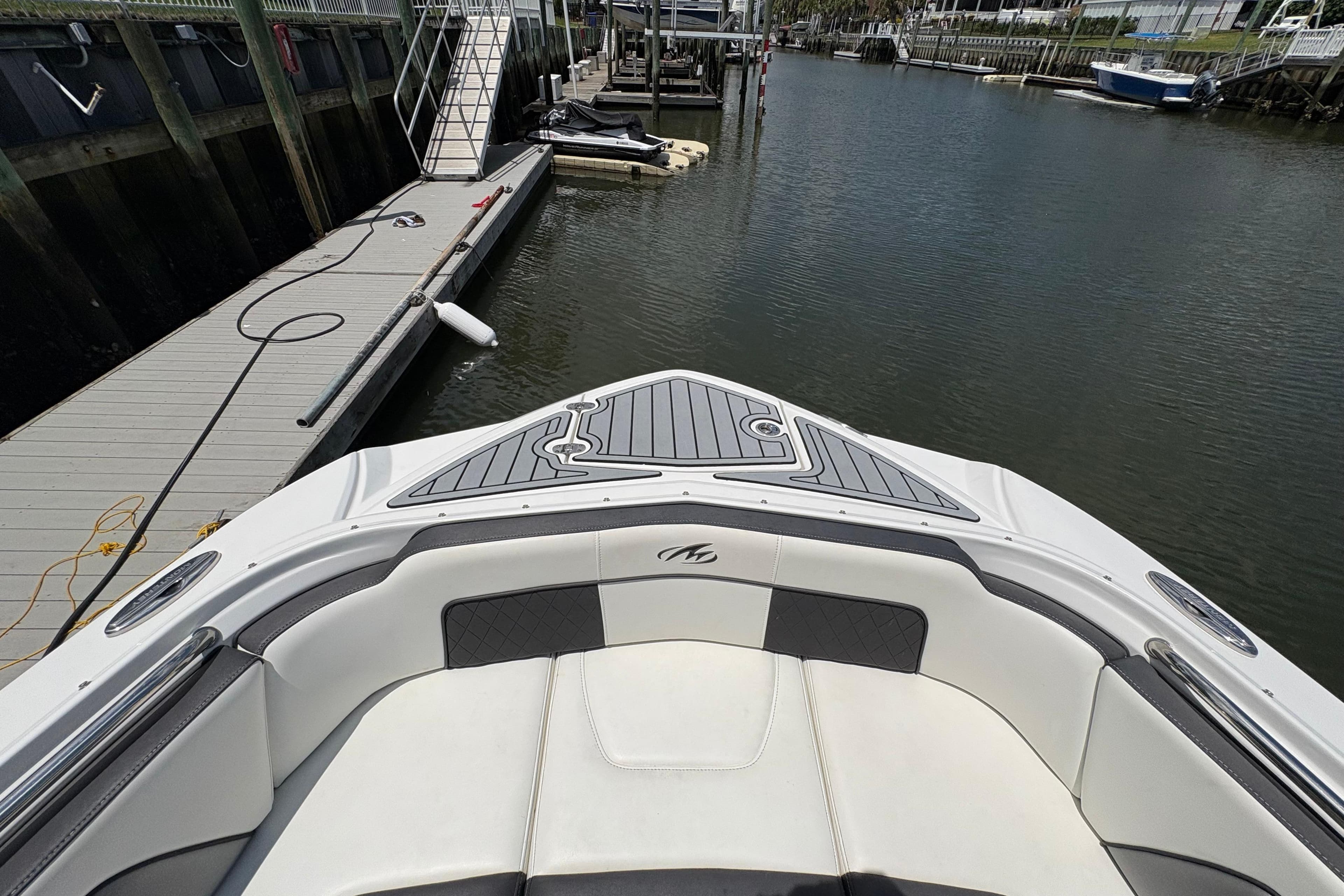 Bow view of 2020 Monterey M-65 boat docked at marina.