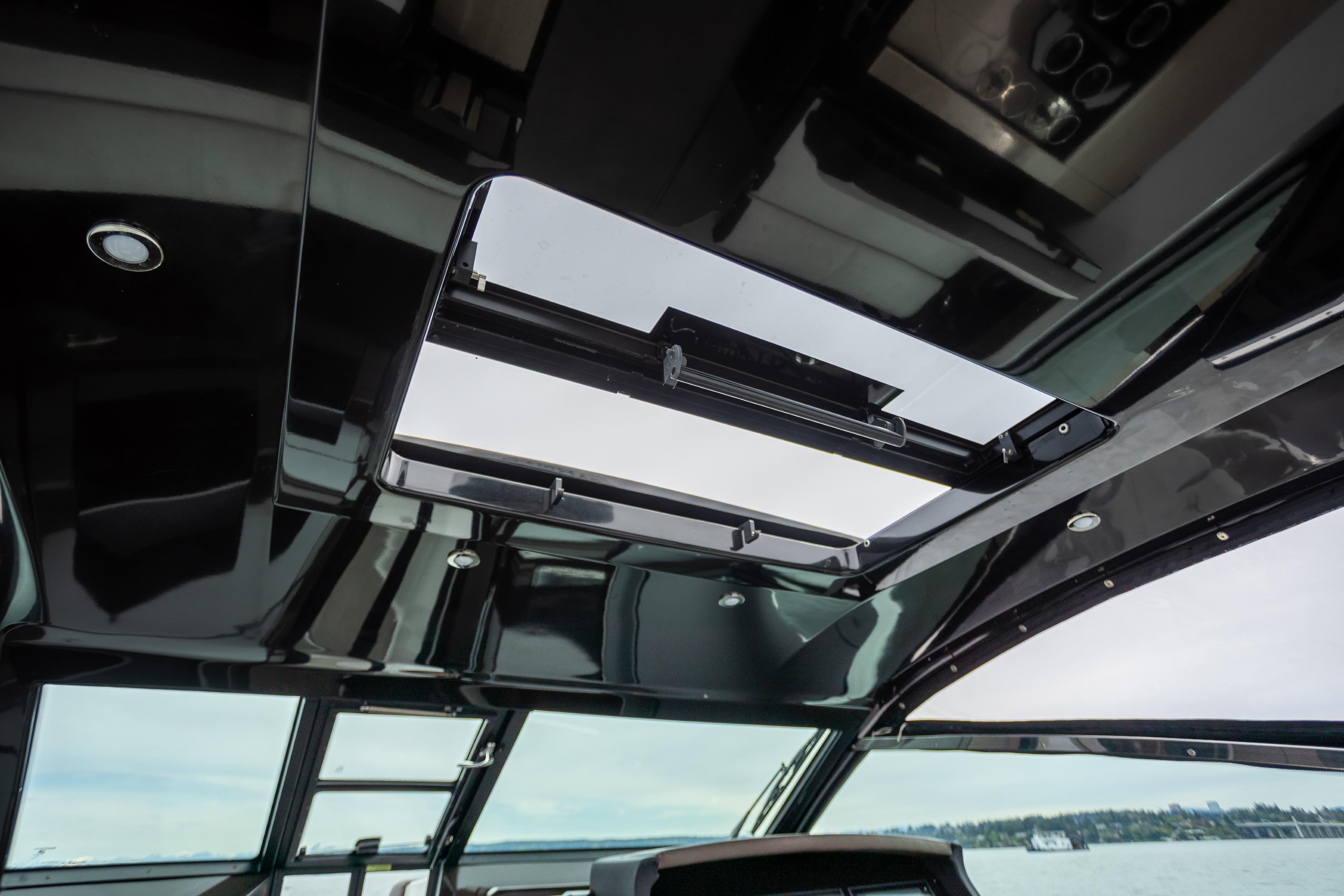 2019 Cobalt A36 yacht interior with open sunroof, showcasing sleek design and modern features.