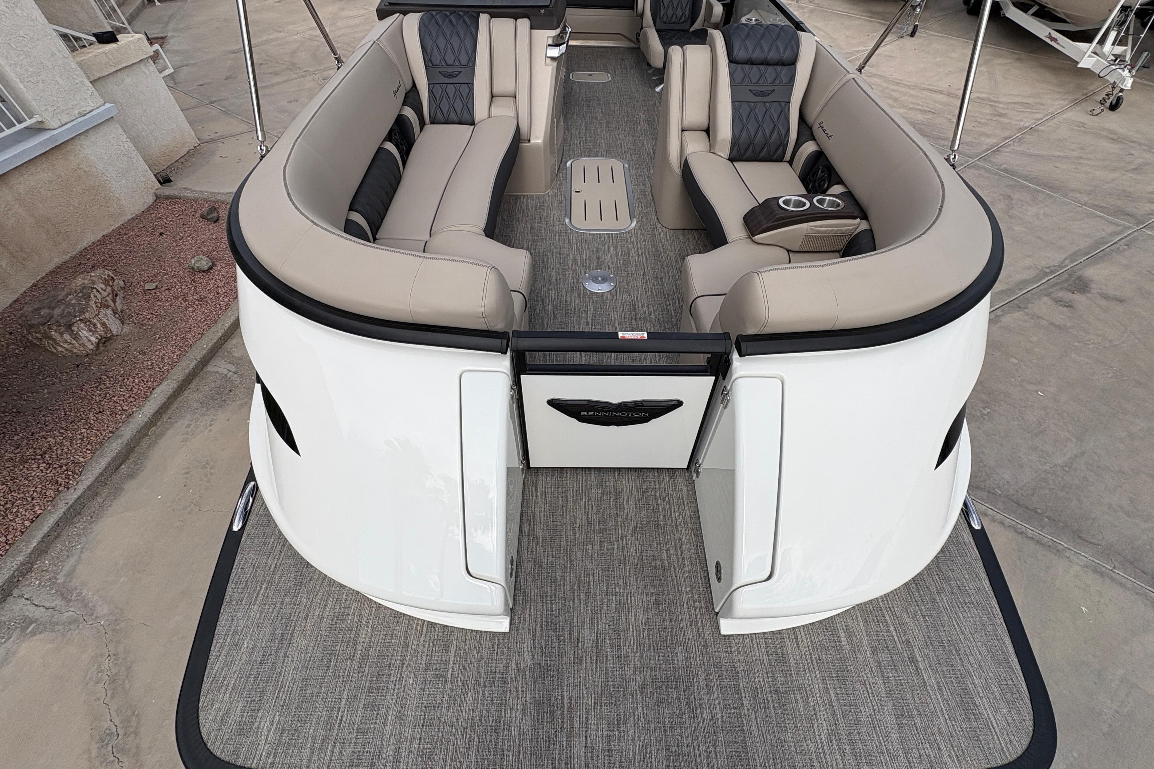Luxurious interior of 2026 Bennington 25 QXSBA pontoon boat with plush seating and modern design.