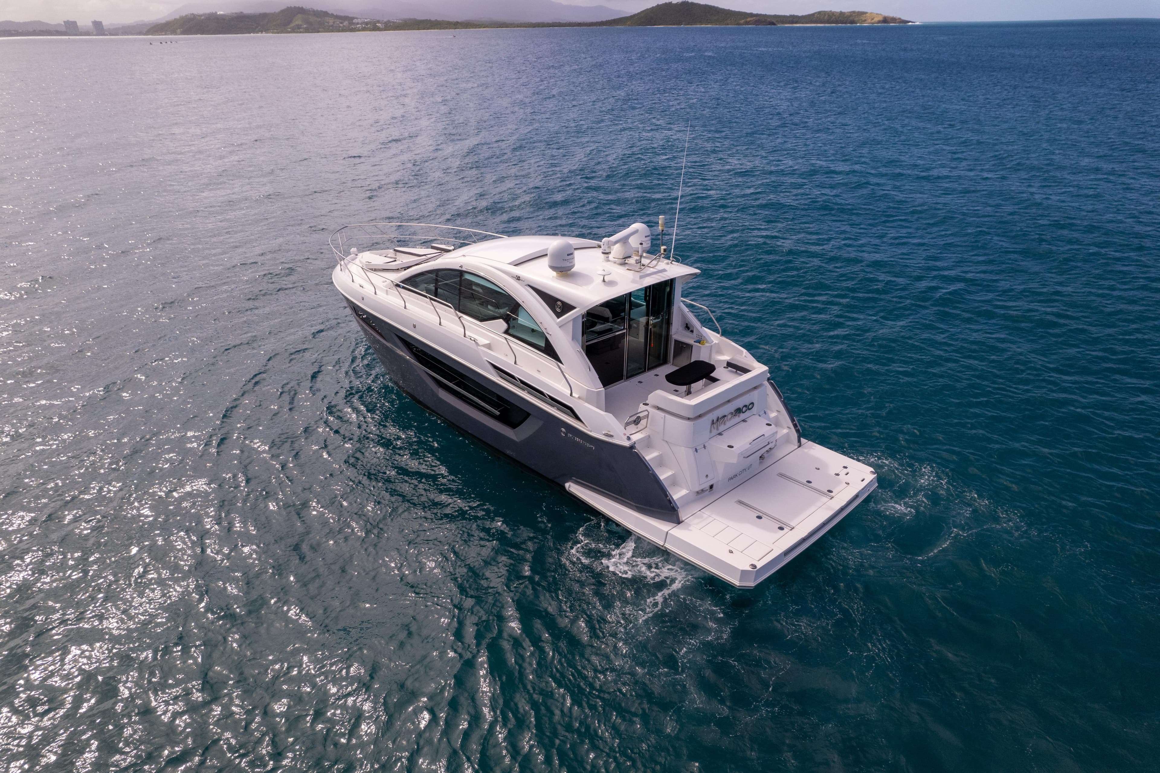 2019 Cruisers Yachts 50 Cantius on open sea.