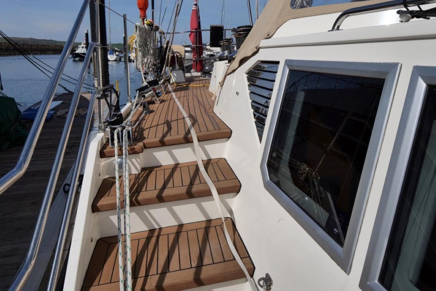 2016 Bruce Roberts 16.5m Expedition Yacht deck with wooden steps and rigging.