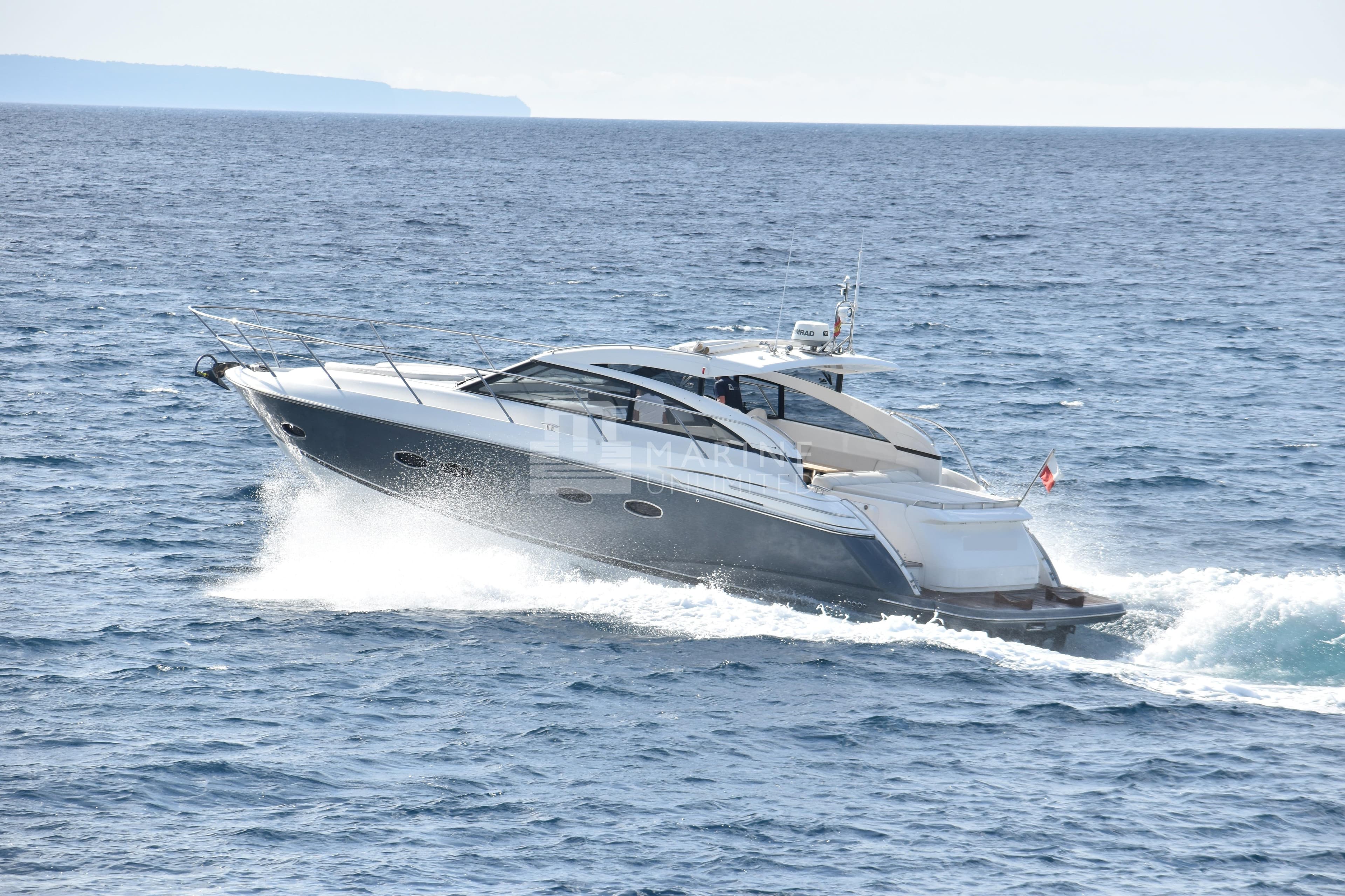 Luxury 2012 Princess V42 yacht cruising on open sea.