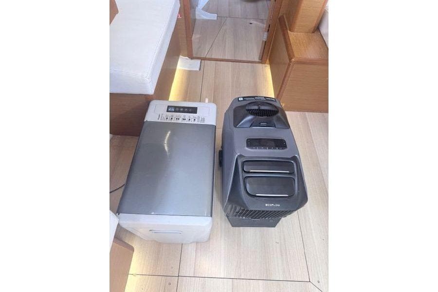Portable appliances on Jeanneau Sun Odyssey 419 yacht, 2018 model, wooden interior.