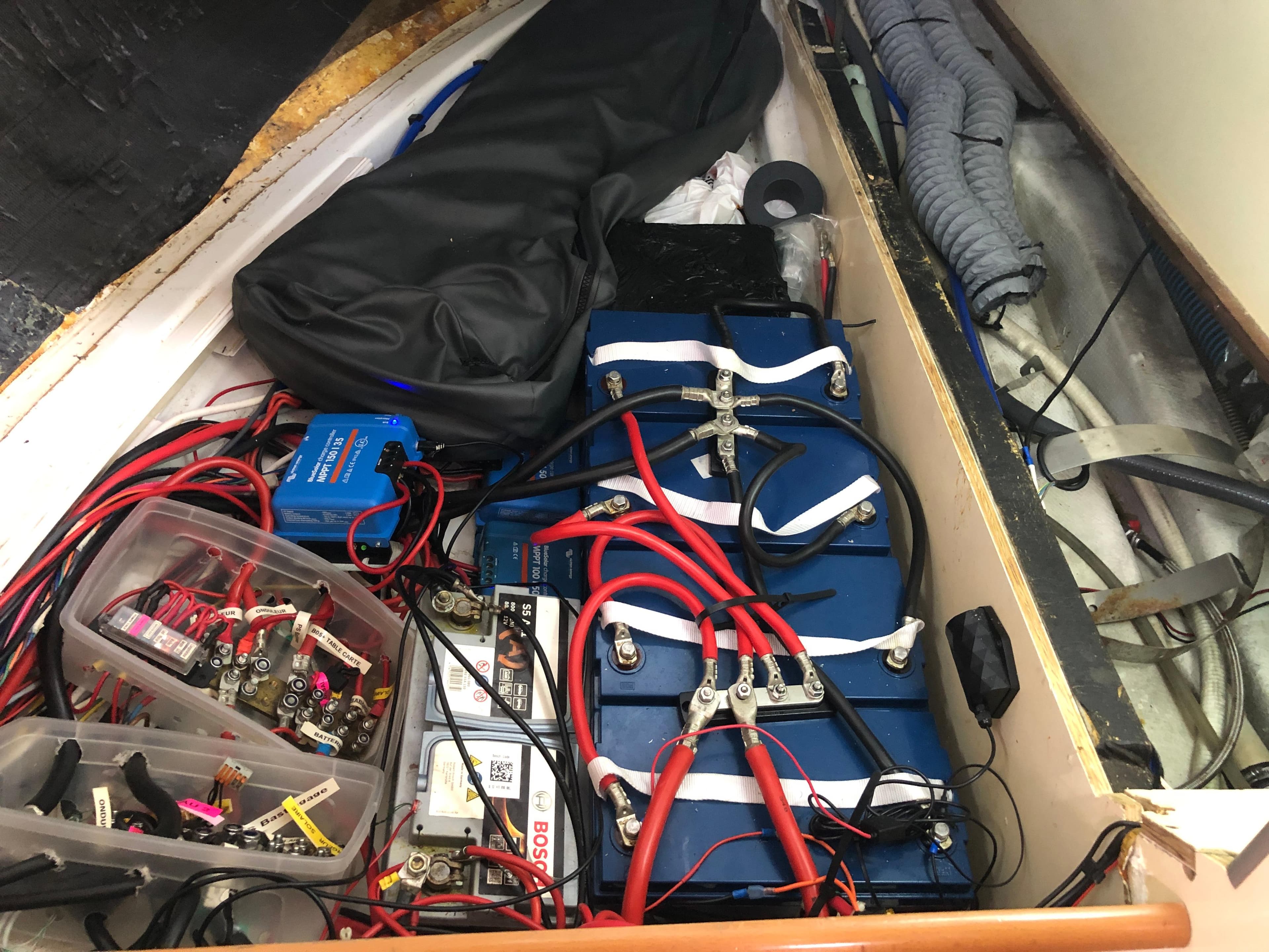 Electrical system setup in a 2006 Harmony 38 boat, featuring batteries and wiring.