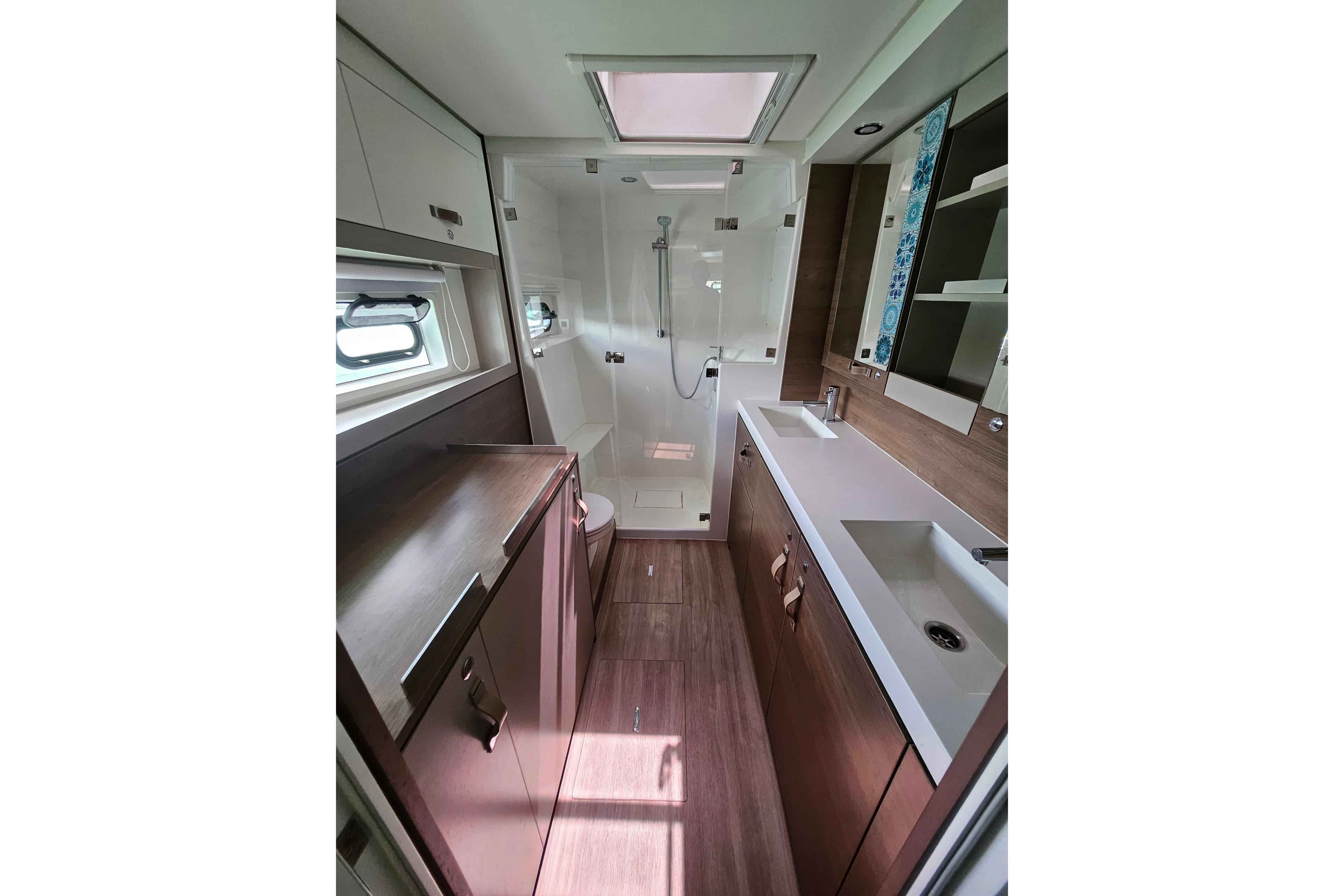 Luxurious bathroom in 2022 Bali 4.4 Owners Version yacht, featuring modern fixtures and ample storage.