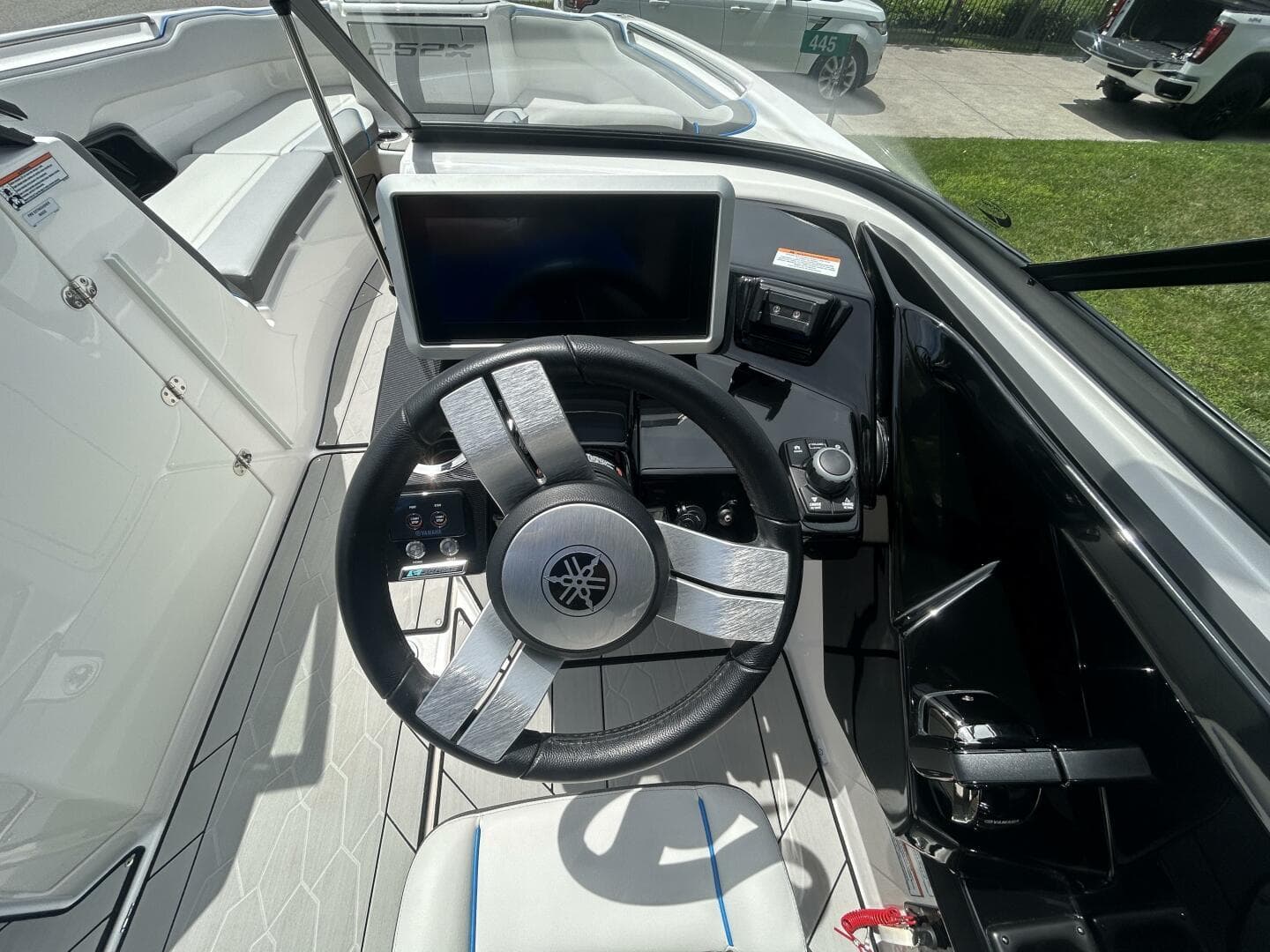 2021 Yamaha Boats 252 XE Wake Edition dashboard with steering wheel and touchscreen display.