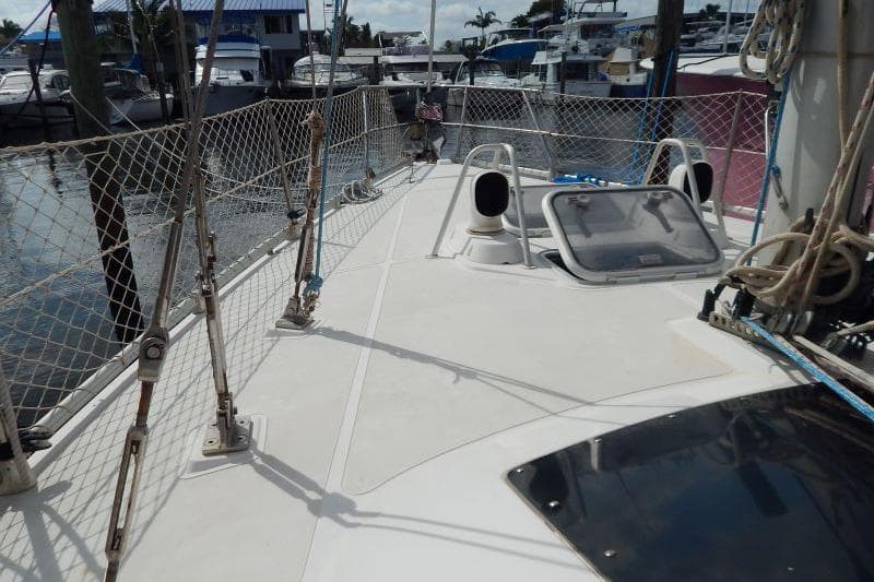 Deck view of a 1997 Etap 38i sailboat docked at a marina.