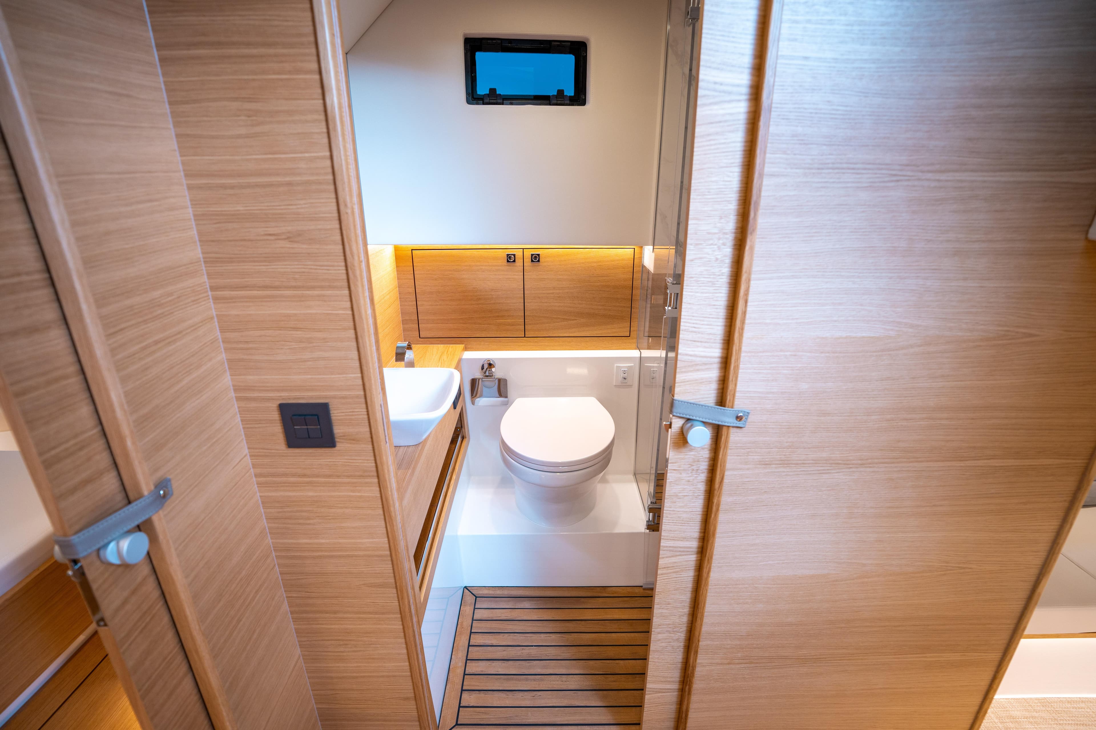 Luxurious bathroom interior of 2025 De Antonio Yachts D42 Open, featuring modern fixtures and wood accents.