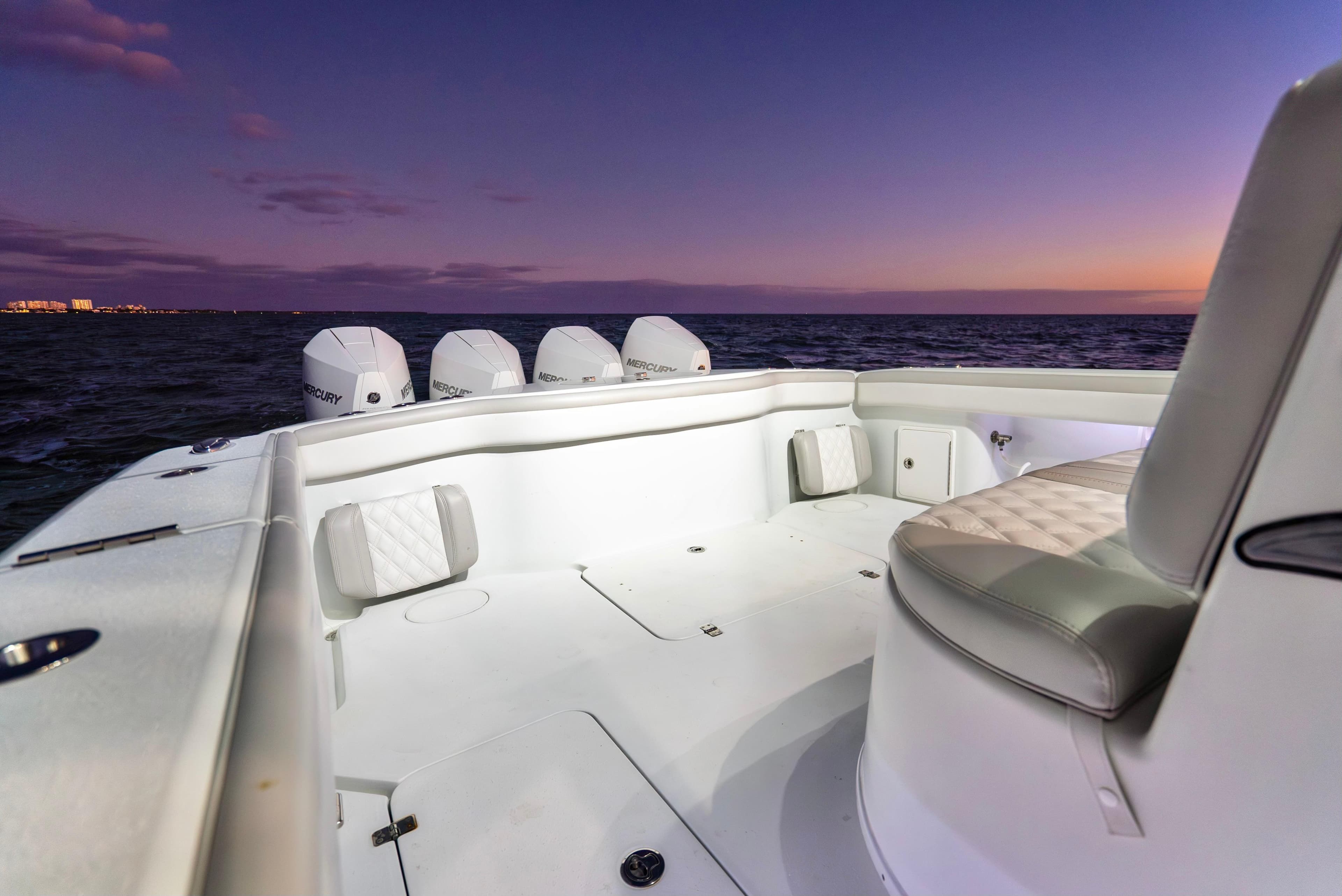 2016 Yellowfin 39 Offshore boat at sunset, featuring spacious deck and multiple engines.