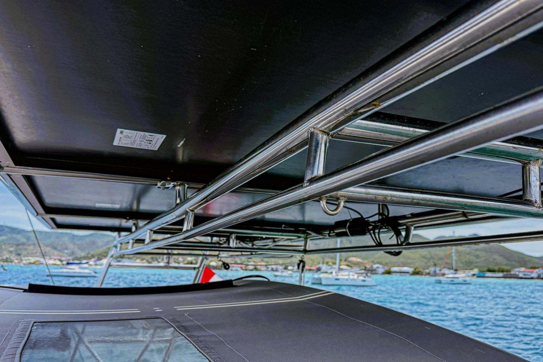Beneteau Oceanis 46.1 yacht, 2020 model, featuring sleek metal framework and scenic ocean backdrop.