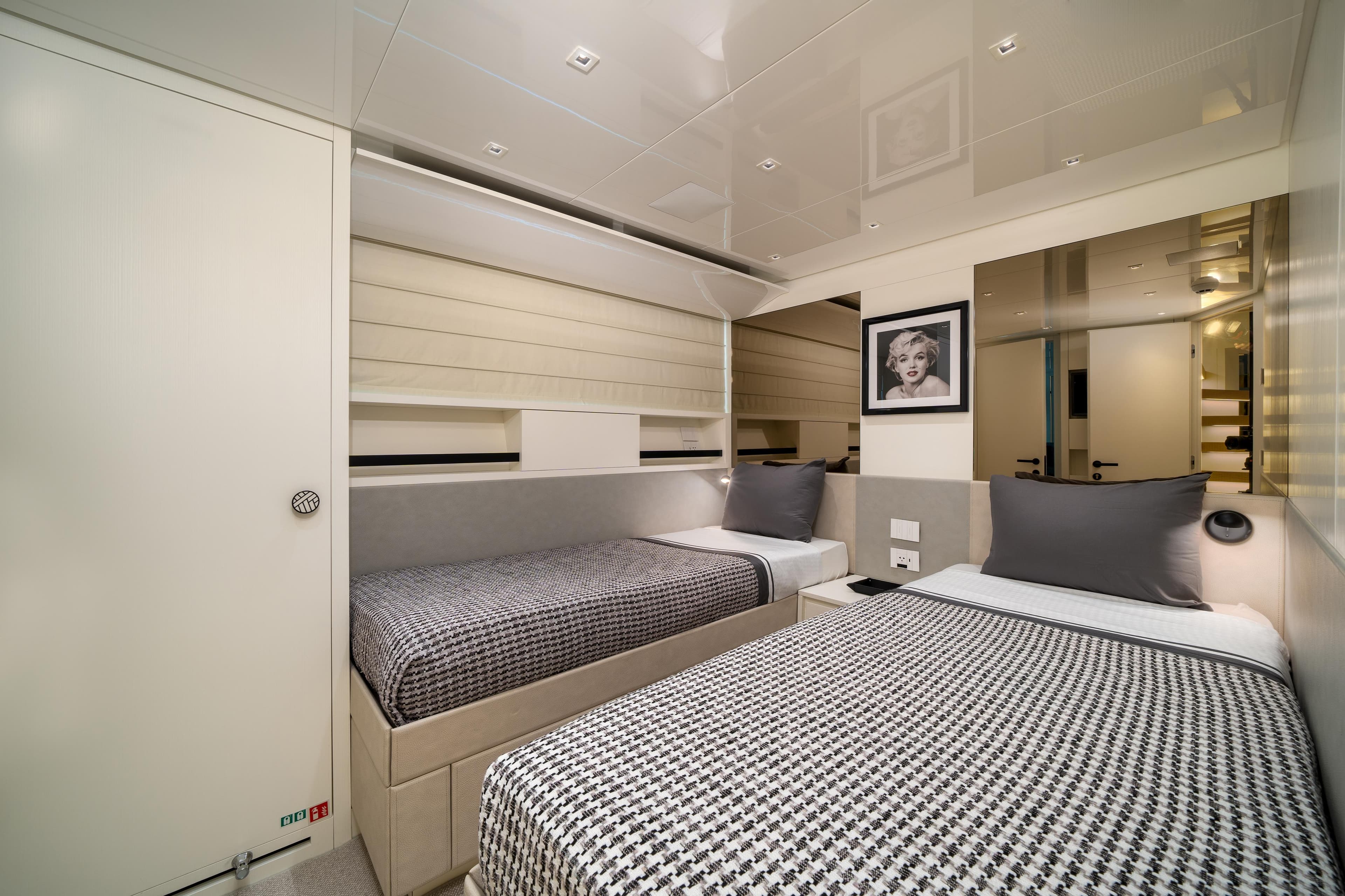 Luxurious 2022 Sanlorenzo SL96A yacht bedroom with twin beds and modern decor.