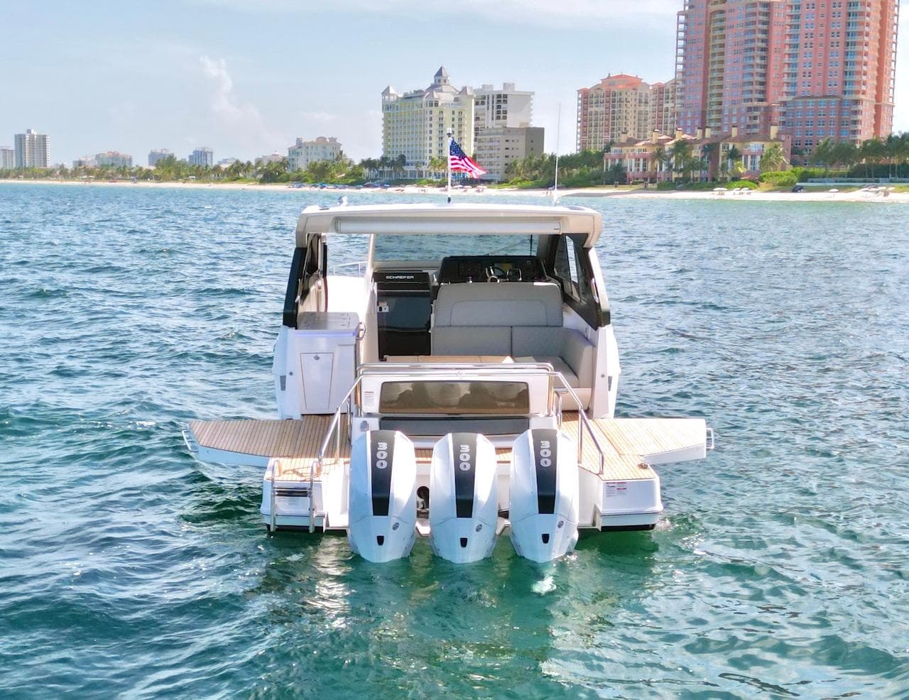 Schaefer 380 yacht from 2027 on water near cityscape.
