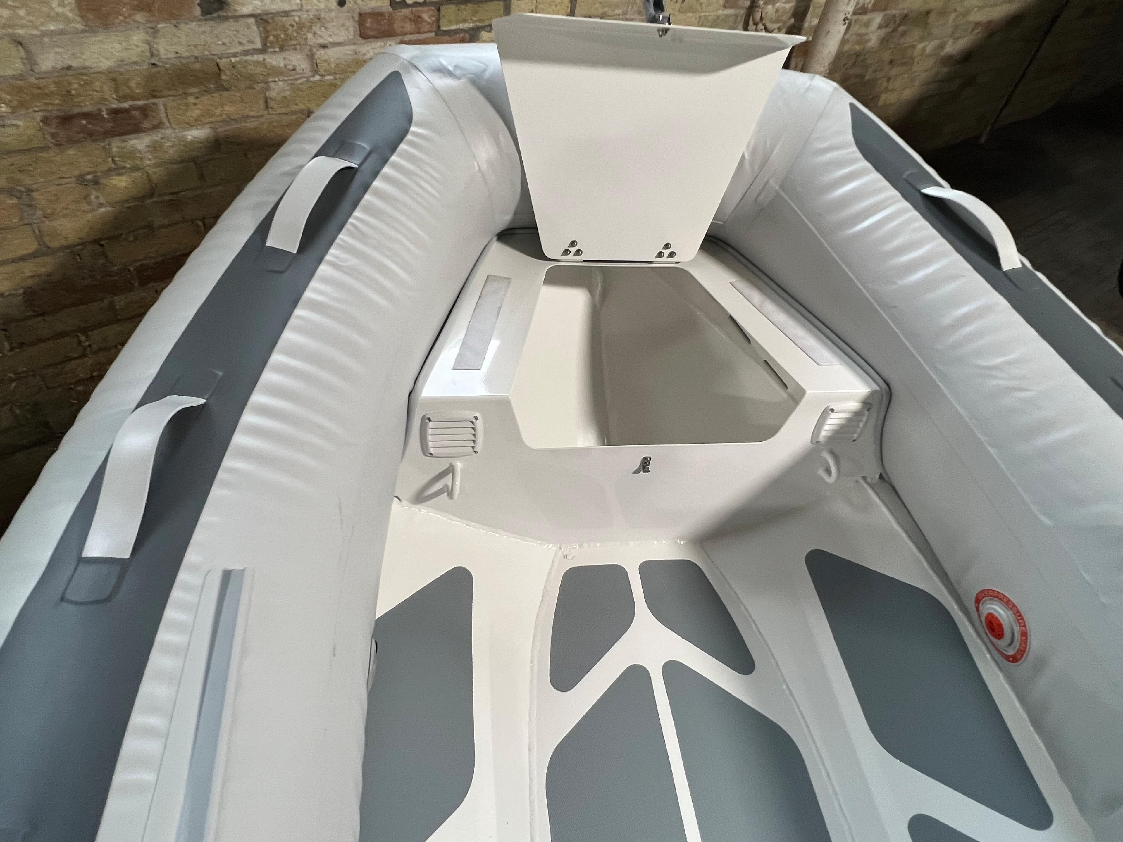 2023 Gala A300D inflatable boat interior with storage compartment and padded seating.