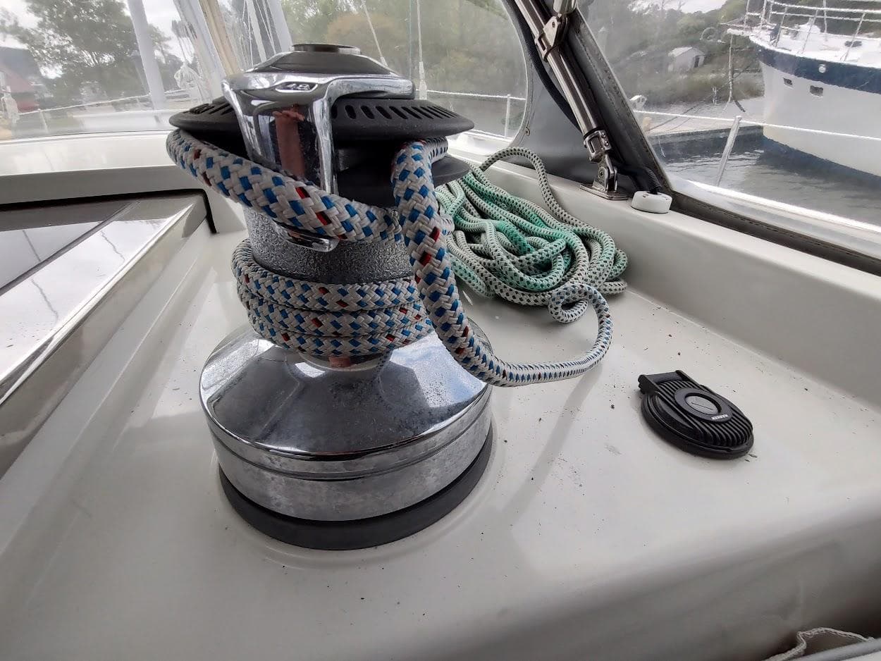 Sailboat winch with ropes on a 2005 Stevens Custom 53/56 yacht deck.