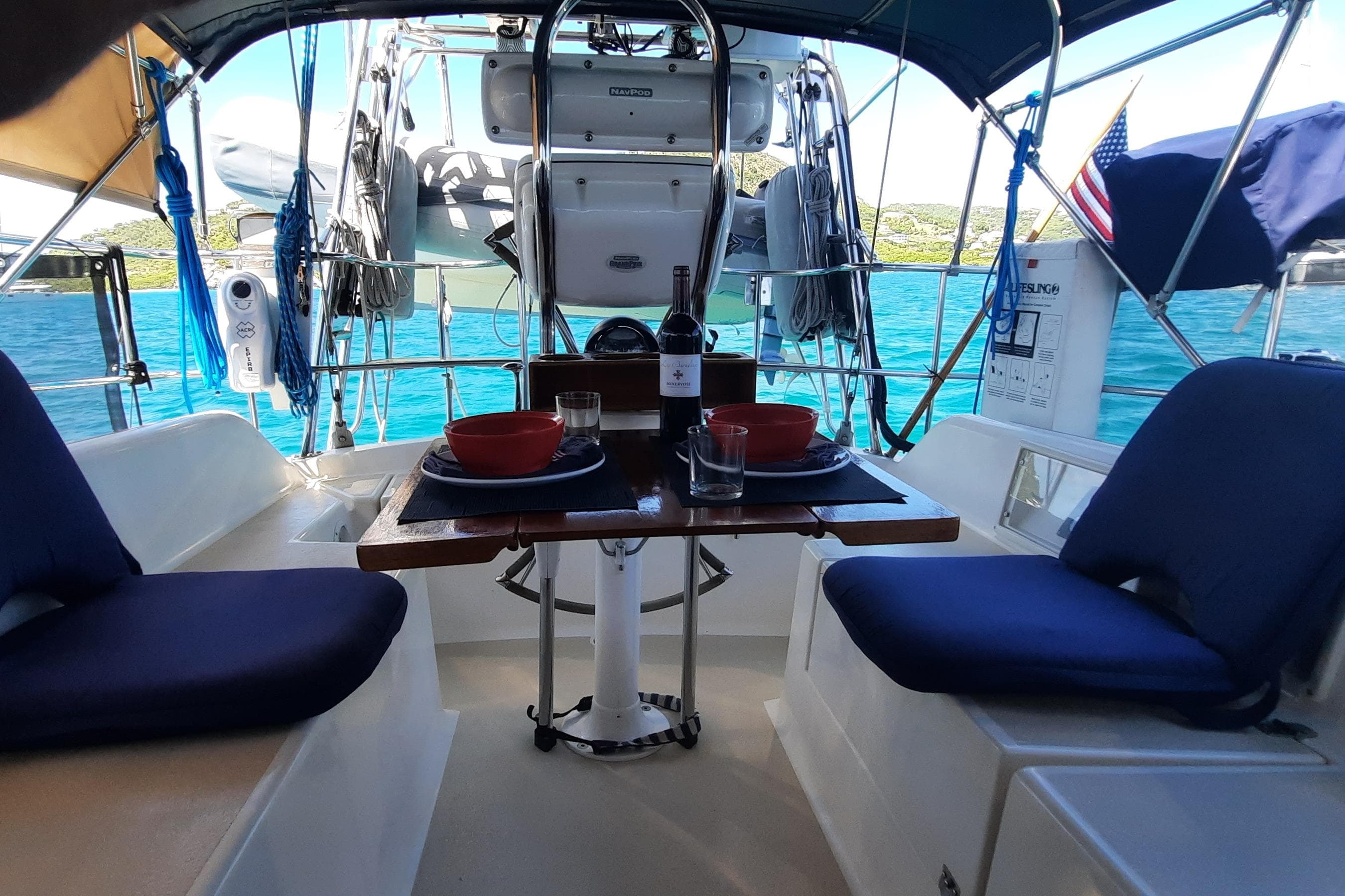 Cozy dining setup on 2005 Caliber 40LRC SE sailboat with ocean view.