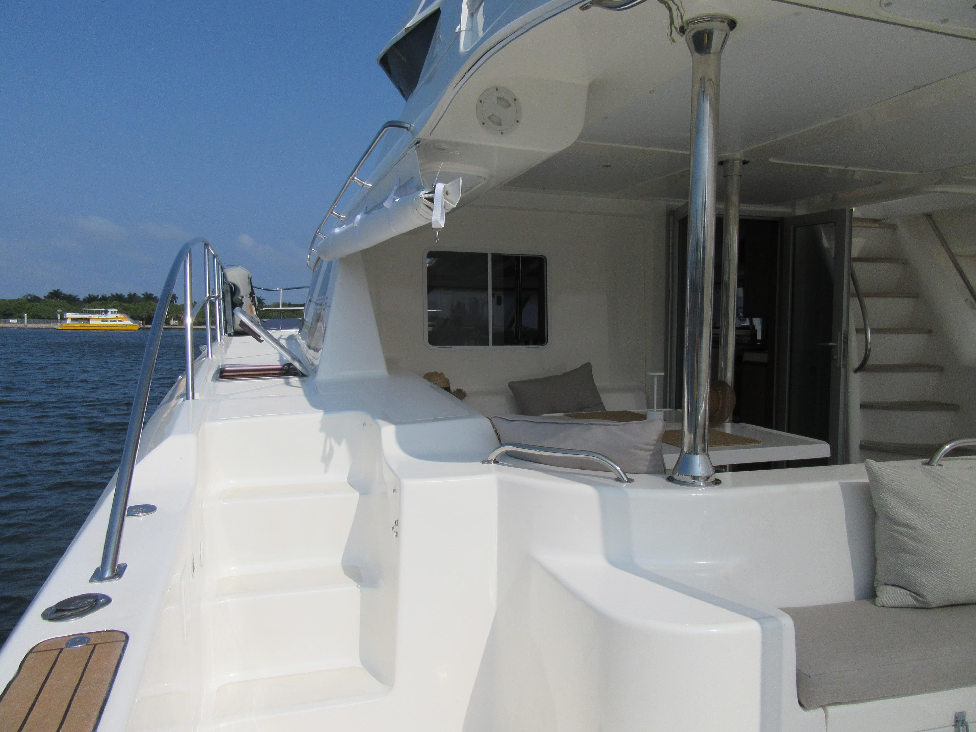 2008 Africat Marine 420 yacht, spacious deck with seating, docked by calm waters.