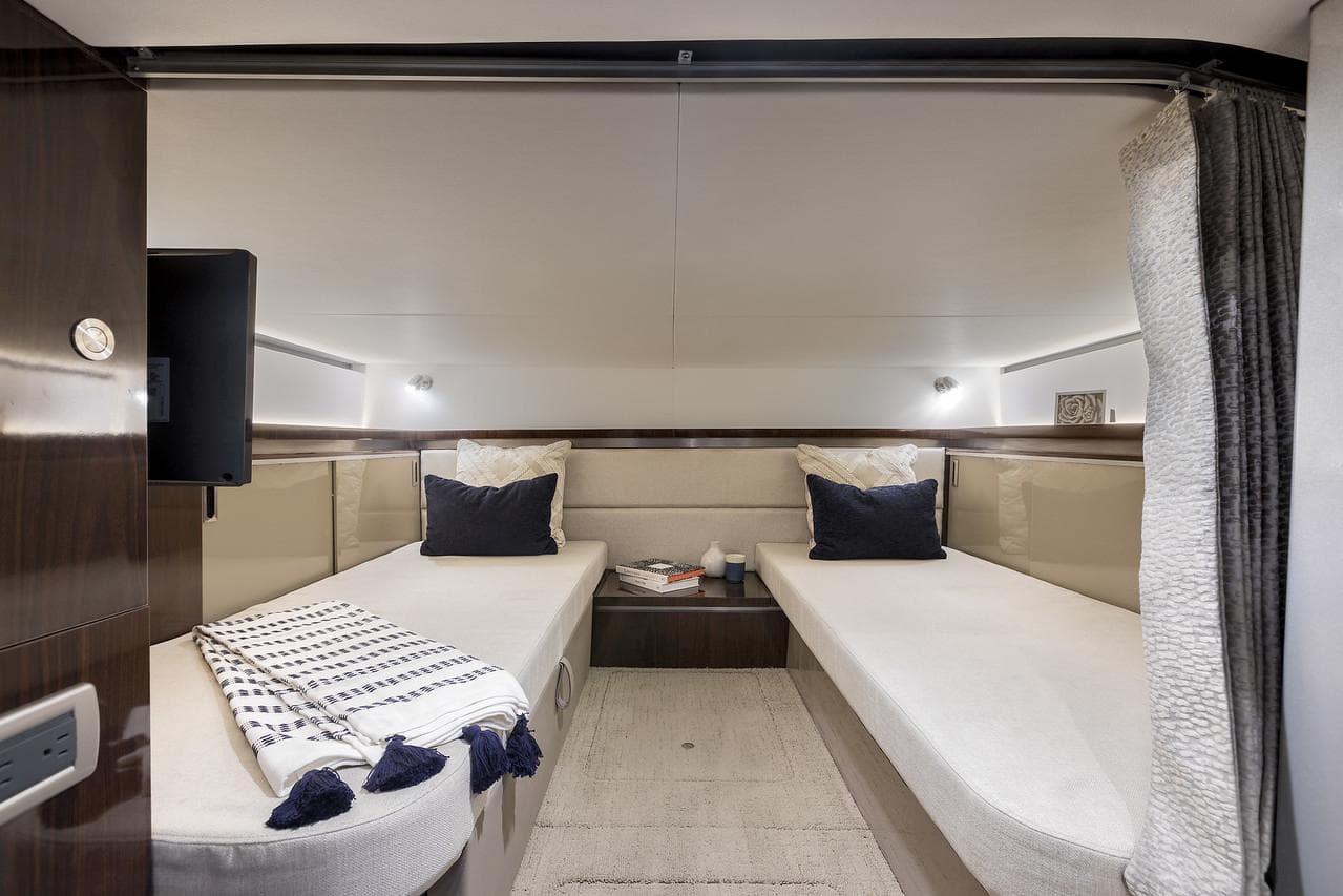 Manufacturer Provided Image: Interior cabin of 2022 Sea Ray Sundancer 320 with twin beds and modern decor.