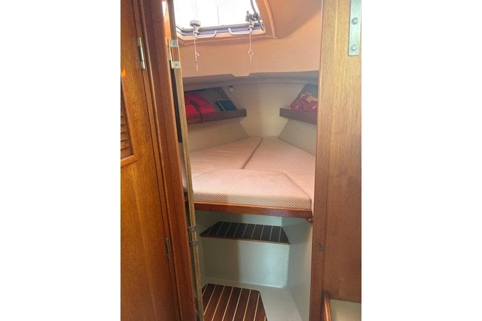 Cozy cabin interior of 1982 C&C Yachts 37 sailboat with wooden accents.