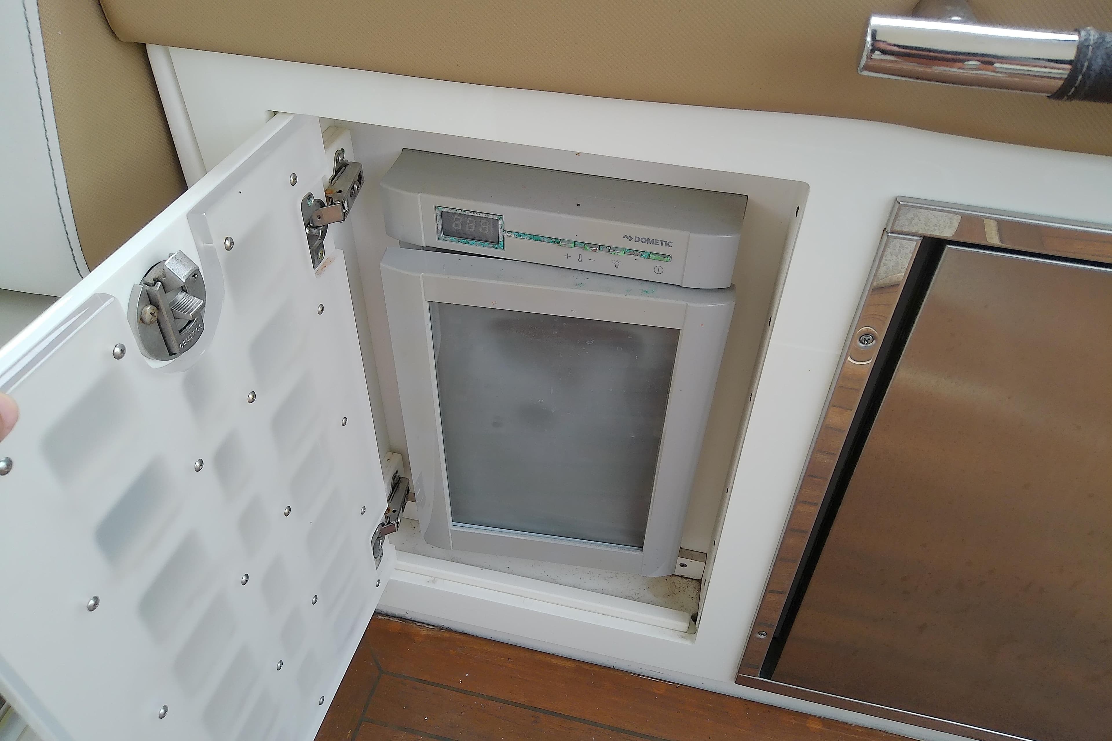 Built-in refrigerator on 2019 Sea Ray SLX 400 Outboard boat, open compartment view.