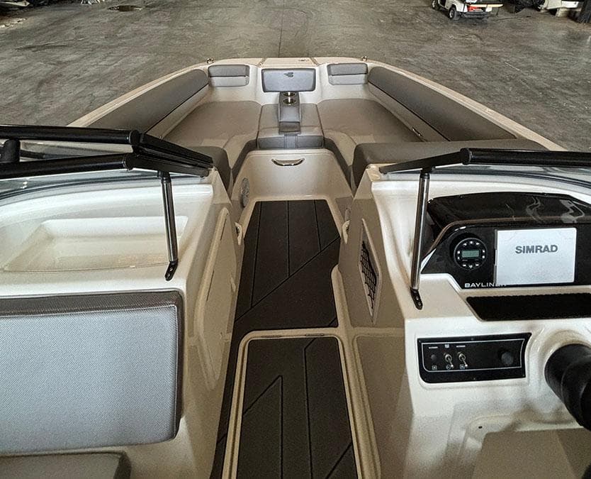 2024 Bayliner DX2000 boat interior with Simrad navigation system and spacious seating.