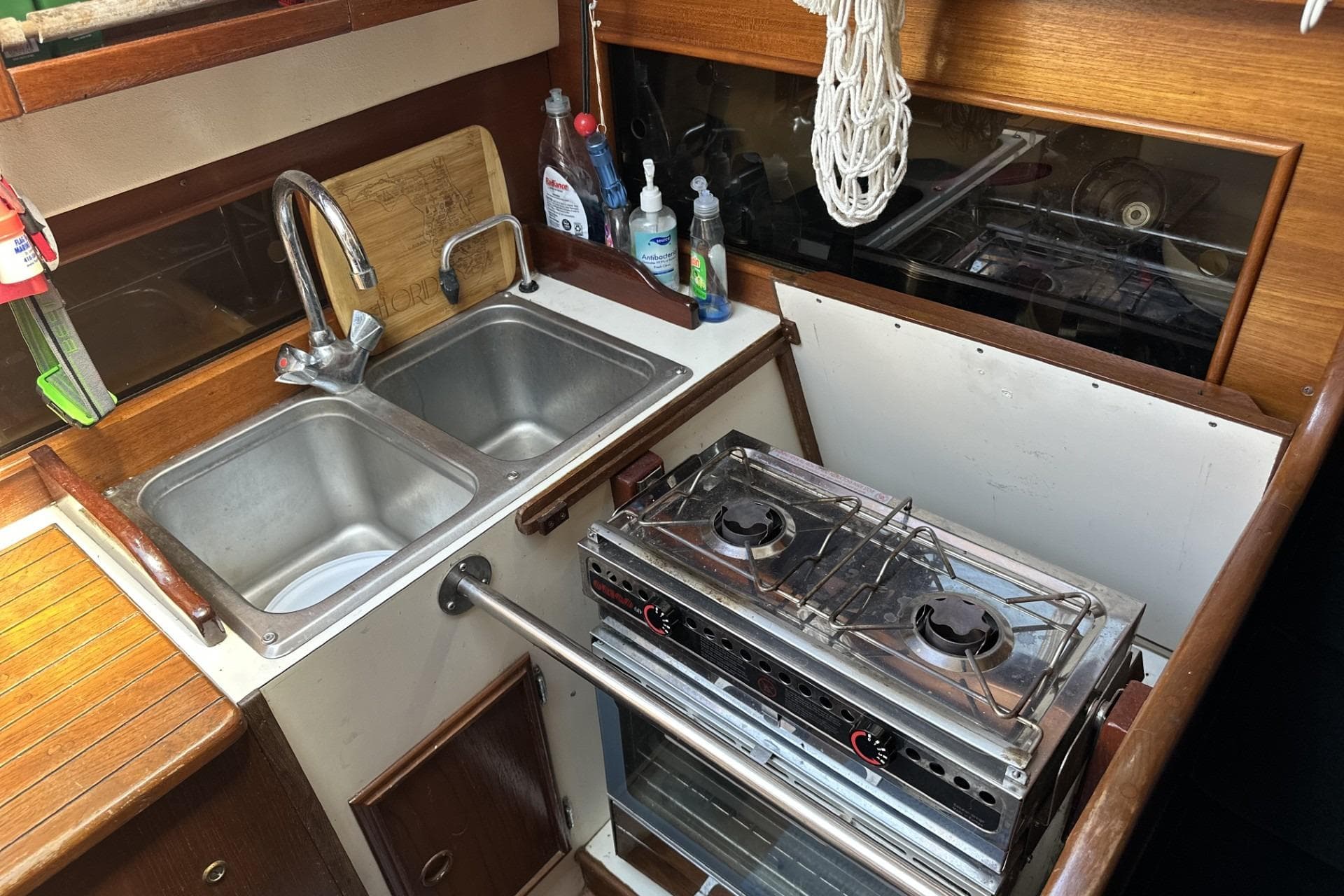1982 Cape Dory 30 yacht kitchen with dual sink and two-burner stove.