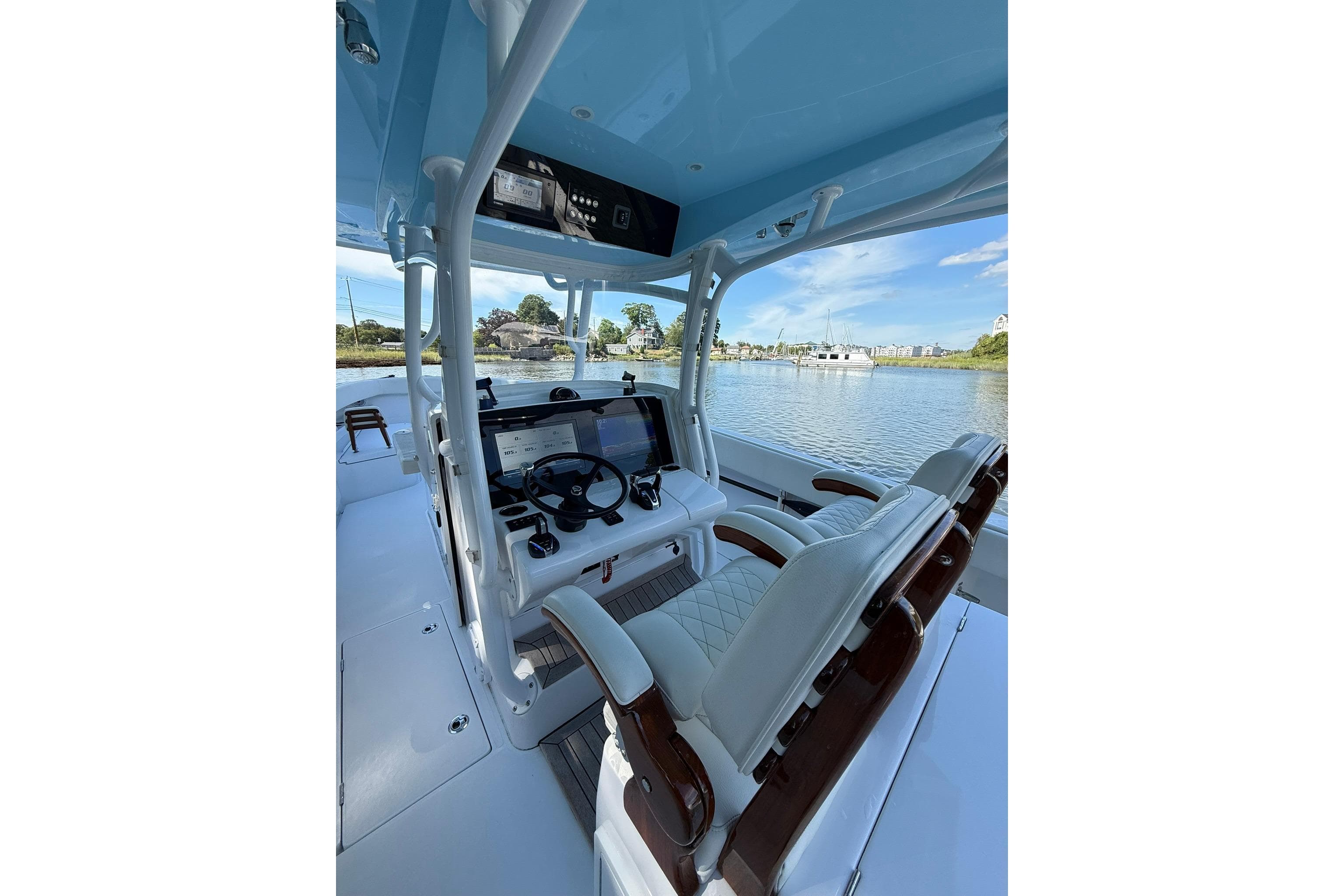 Interior view of 2021 Jupiter 38 HFS boat with modern helm and seating.