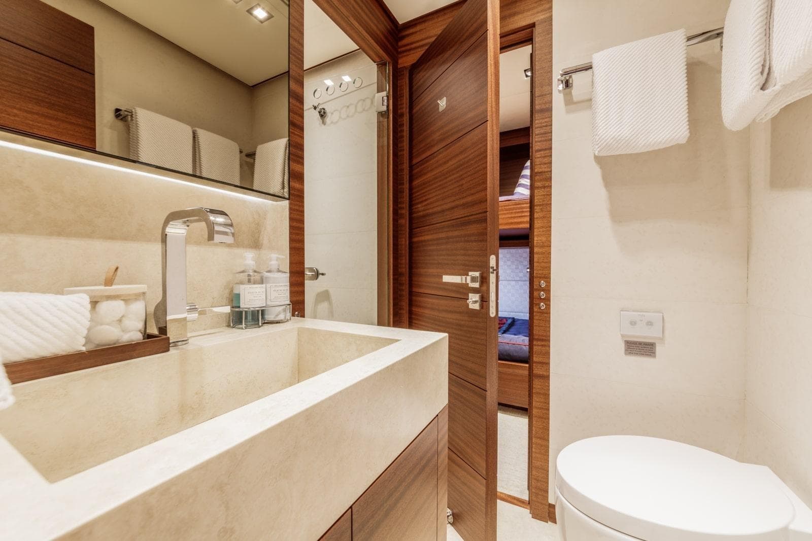 Luxurious bathroom in 2013 Vicem Raised Pilothouse Motoryacht with modern fixtures and wooden accents.