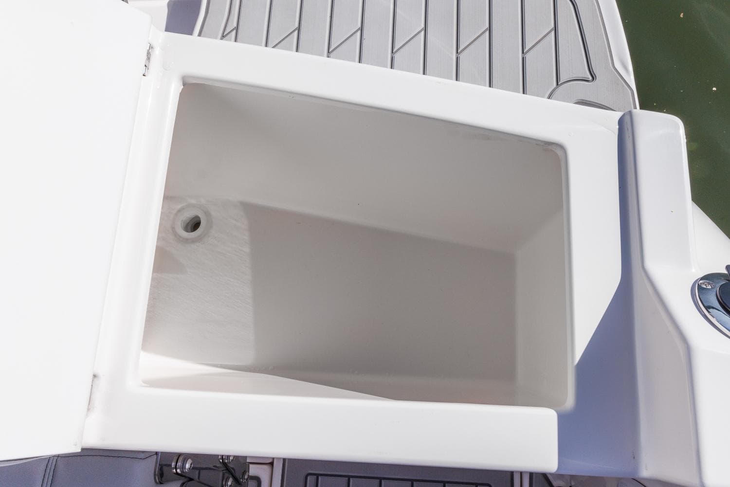 Open storage compartment on 2025 Solara S-250 Coupe boat deck.
