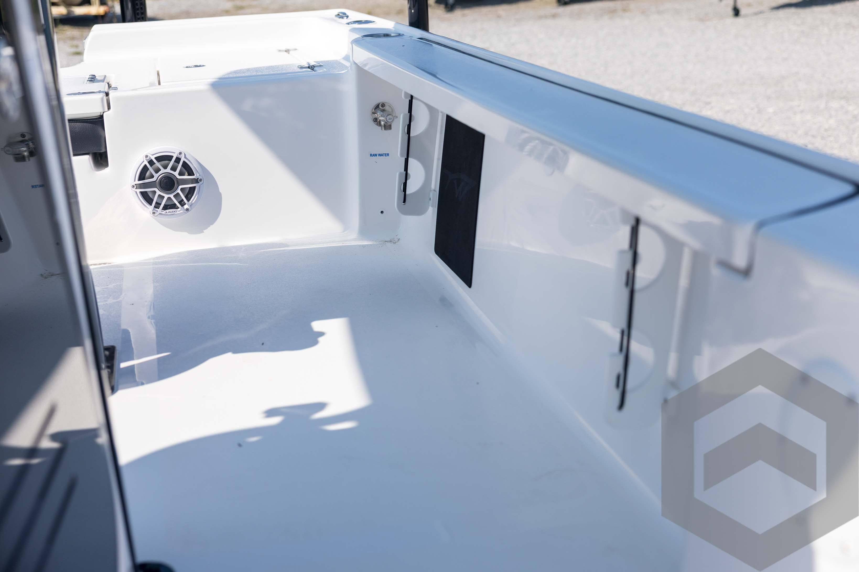 2026 Tidewater 2410 Bay Max boat interior with speaker and storage compartments.