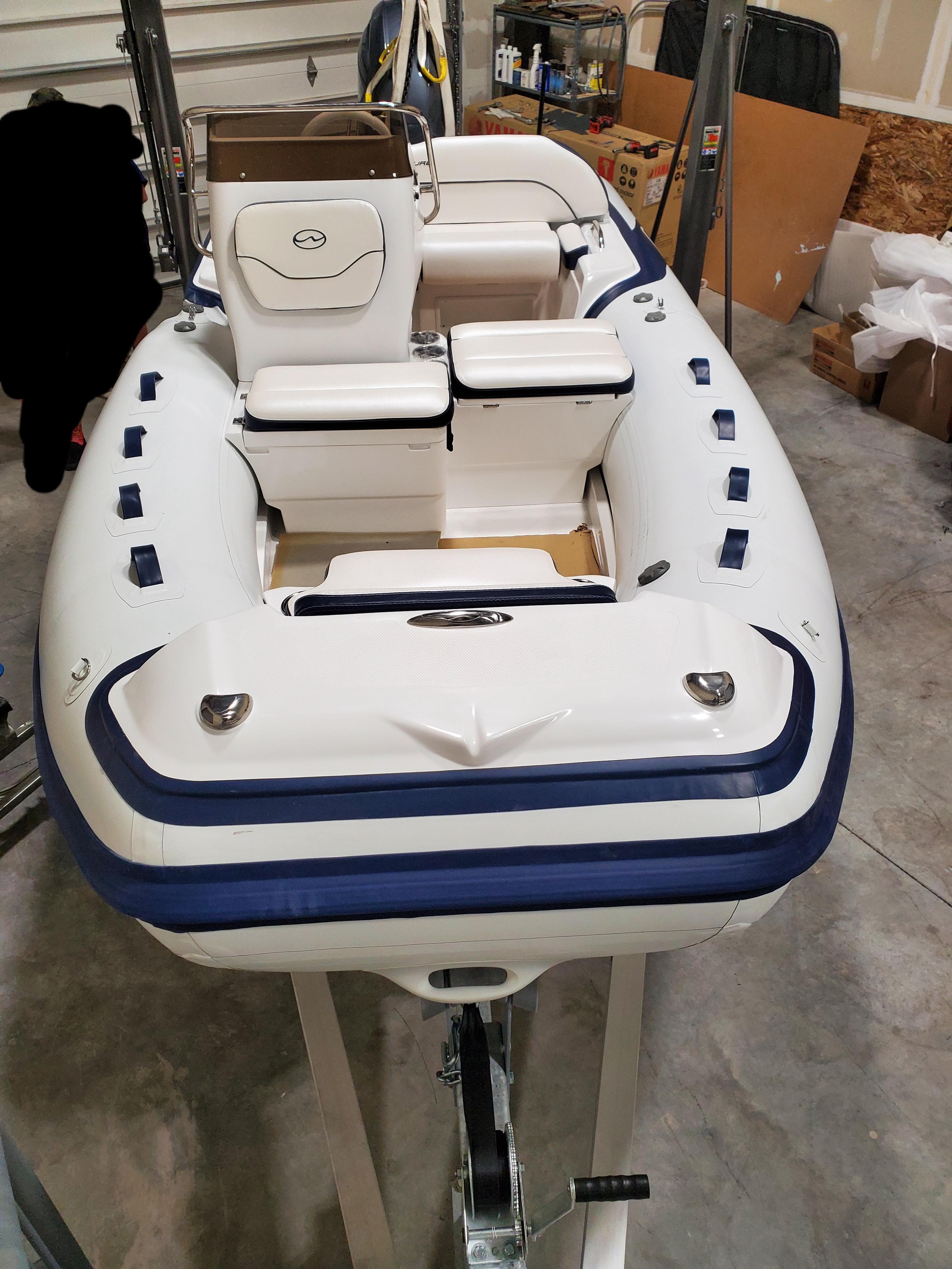 2025 Walker Bay Venture inflatable boat in a garage.