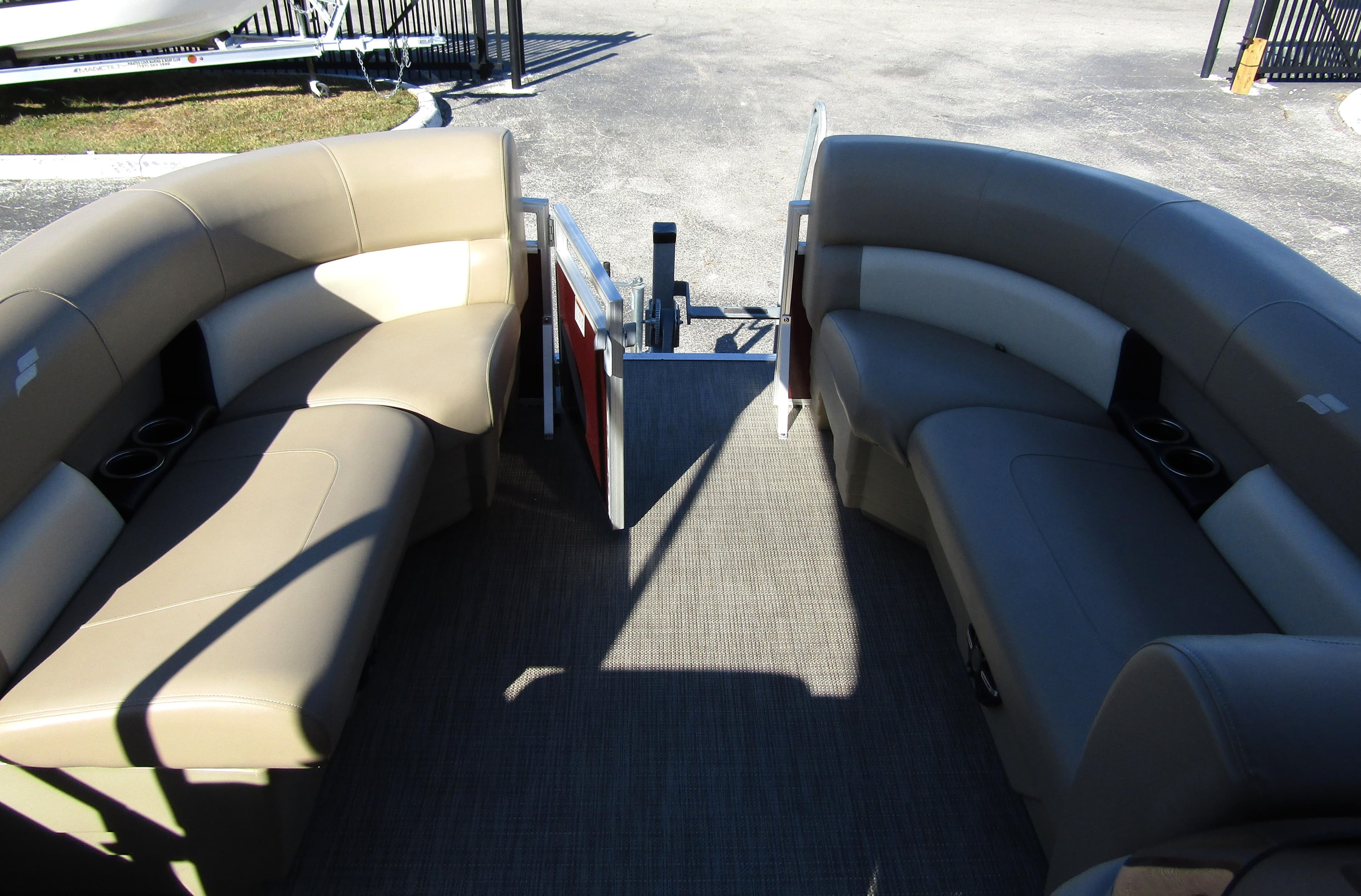 2024 Starcraft LX 20 R pontoon boat interior with beige seating and open deck.