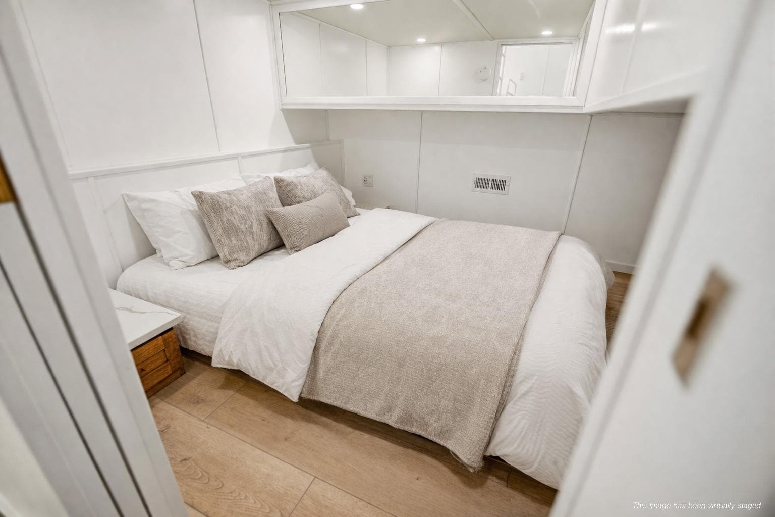 Luxurious bedroom interior on 2026 Sumerset Luxe III Show Boat, featuring elegant bedding and modern design.